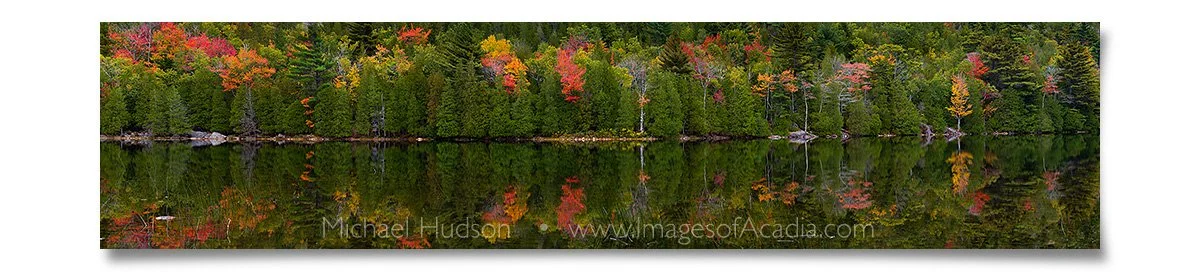 Autumn foliage reflected in the still waters of Bubble Pond, Aca