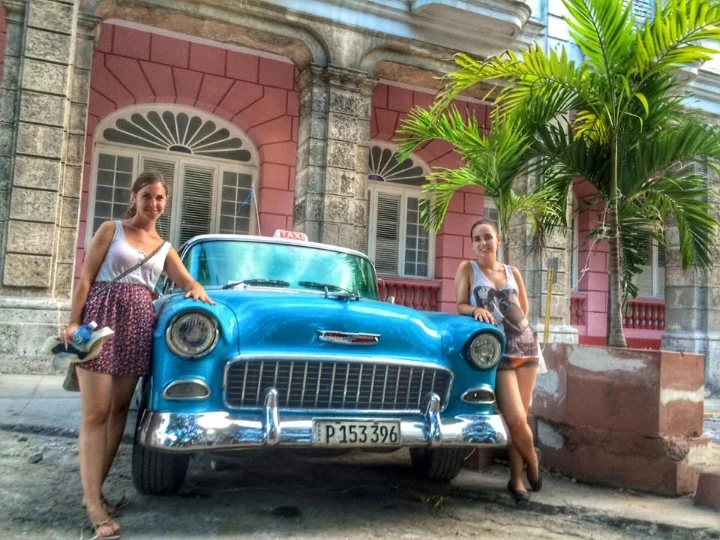 Those vintage cars are taxis. Get a ride, it is such an experience! Ask the taxi driver how much for the ride before getting into the car. You can always negotiate and check with others.