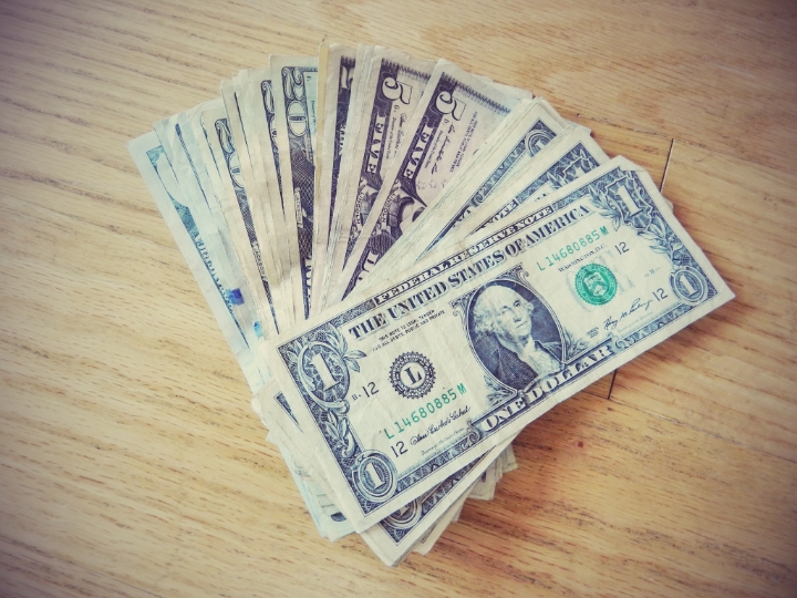 Belize's currency is Belize Dollars but you do NOT want to buy BZ$. Take US Dollars in cash. They accept them everywhere. 1BZ$ = 0.5US$