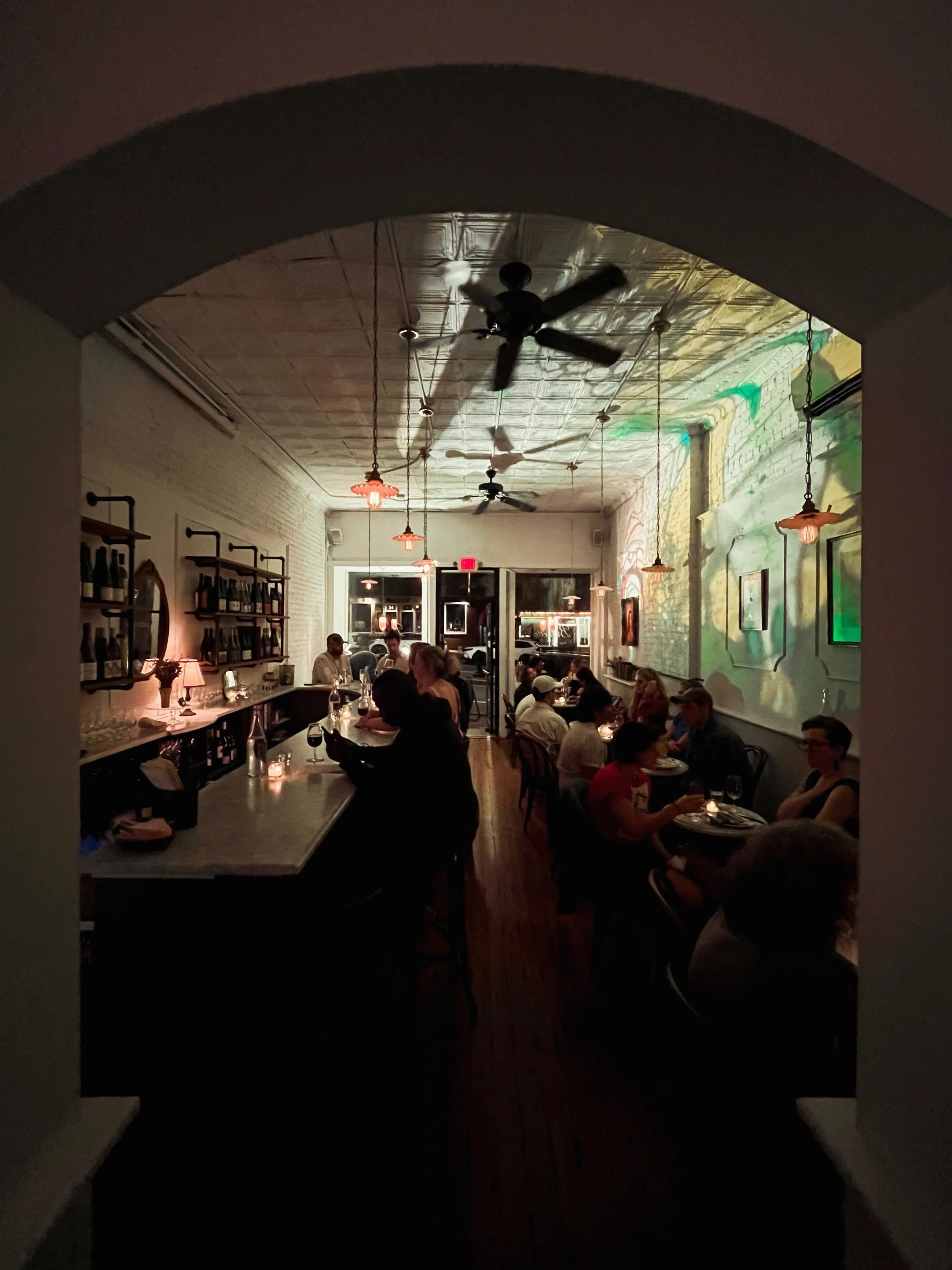 Our little jewel box filled with wine, cozy food, vinyl, kaleidoscopic lights, and new &amp; old friends. Don&rsquo;t miss @slim_corvelli&rsquo;s ATMOSPHER&Eacute;, tonight and every second Saturday of the month. 🪎