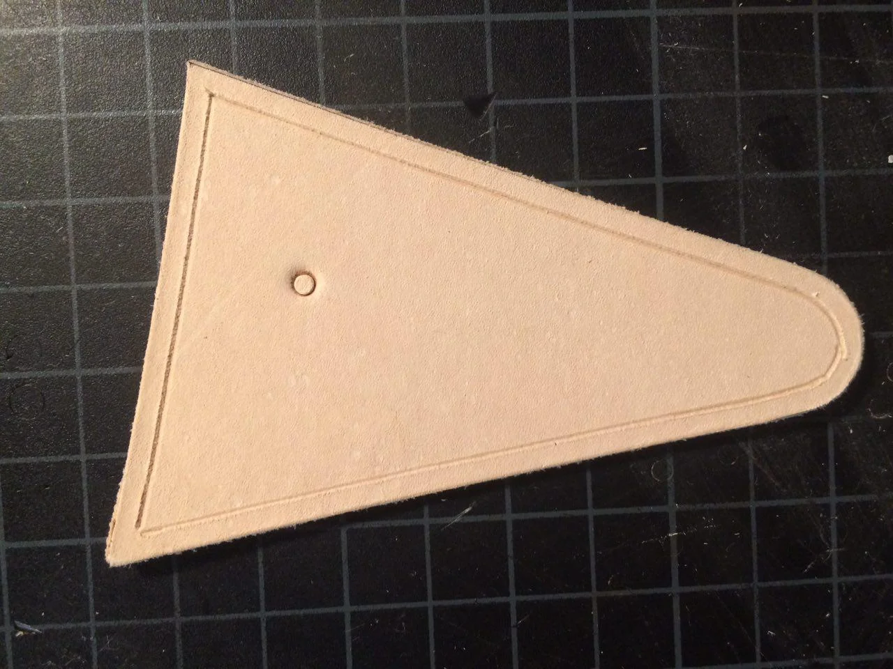 I'll use this piece of scrap leather, that I've already created a stitching channel on, to help explain these three problems.