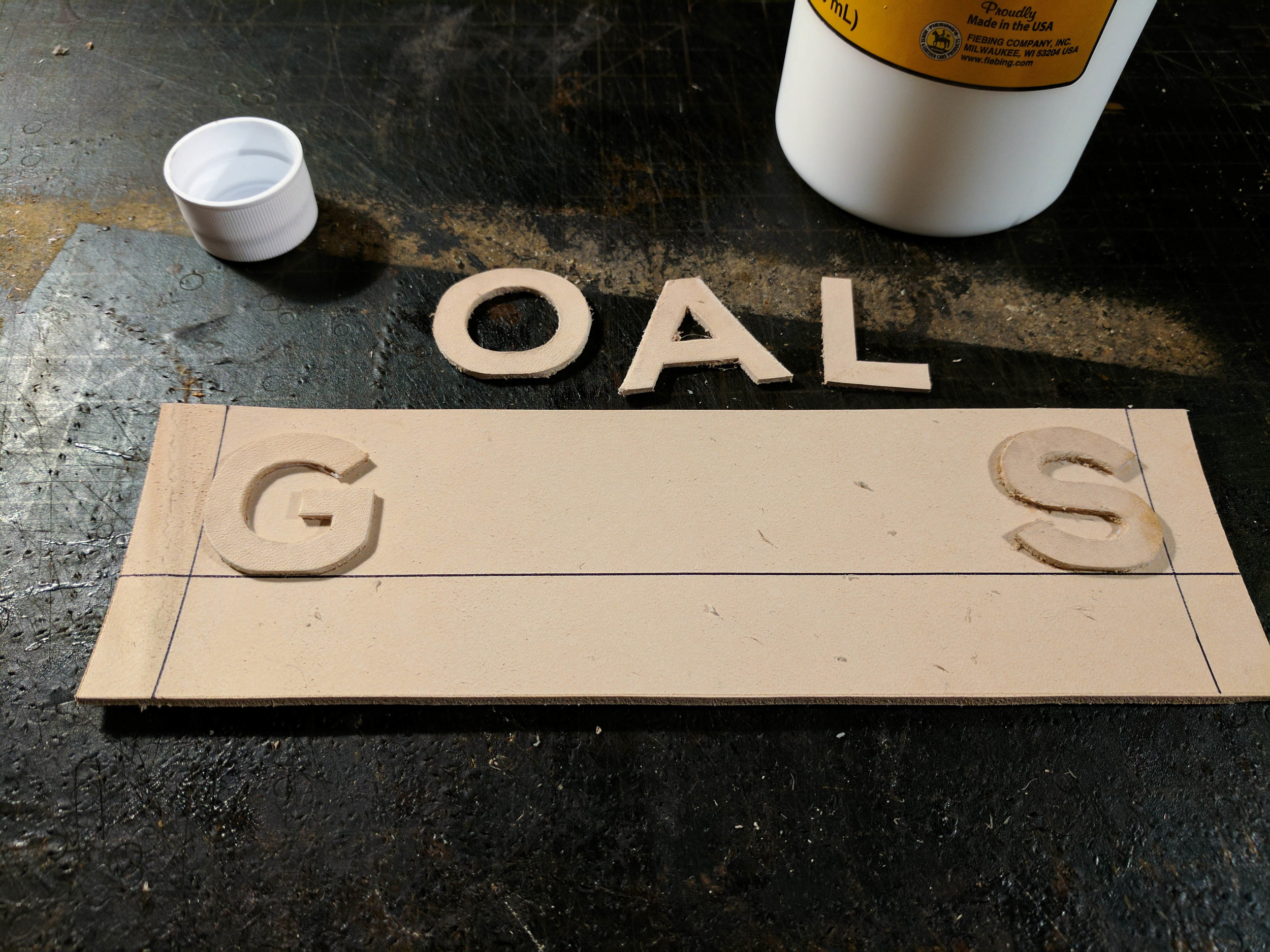 After that I set the 3oz letters on to a 5oz piece of leather, making sure they were centered and spaced correctly.