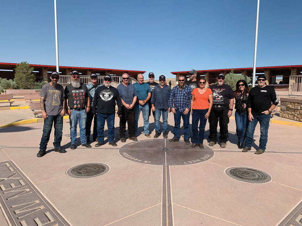 Standing on four states at the Four Corners Monument.