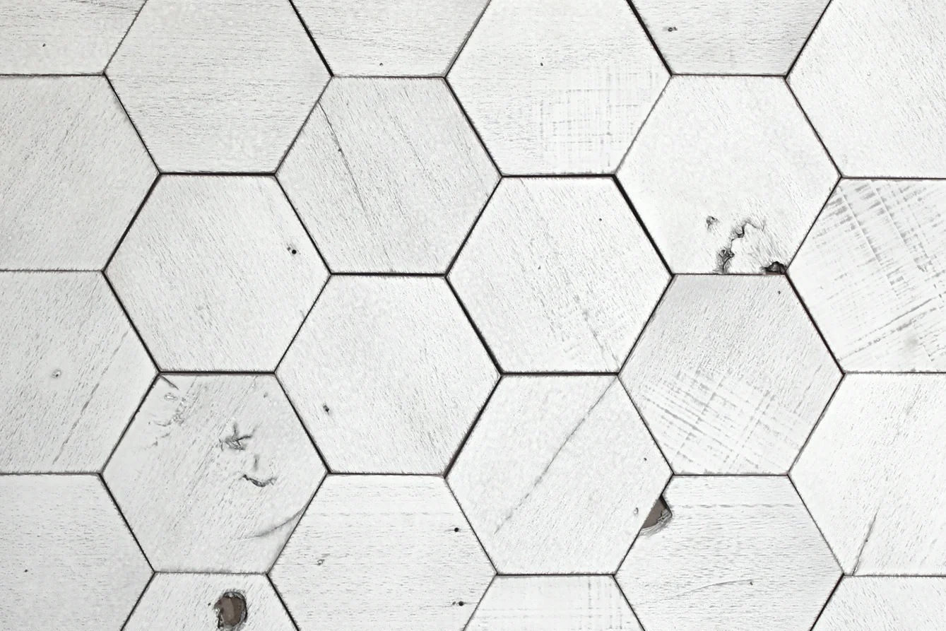 Our hexagon wood tiles measure 6" wide and are available in any of our paneling finishes.