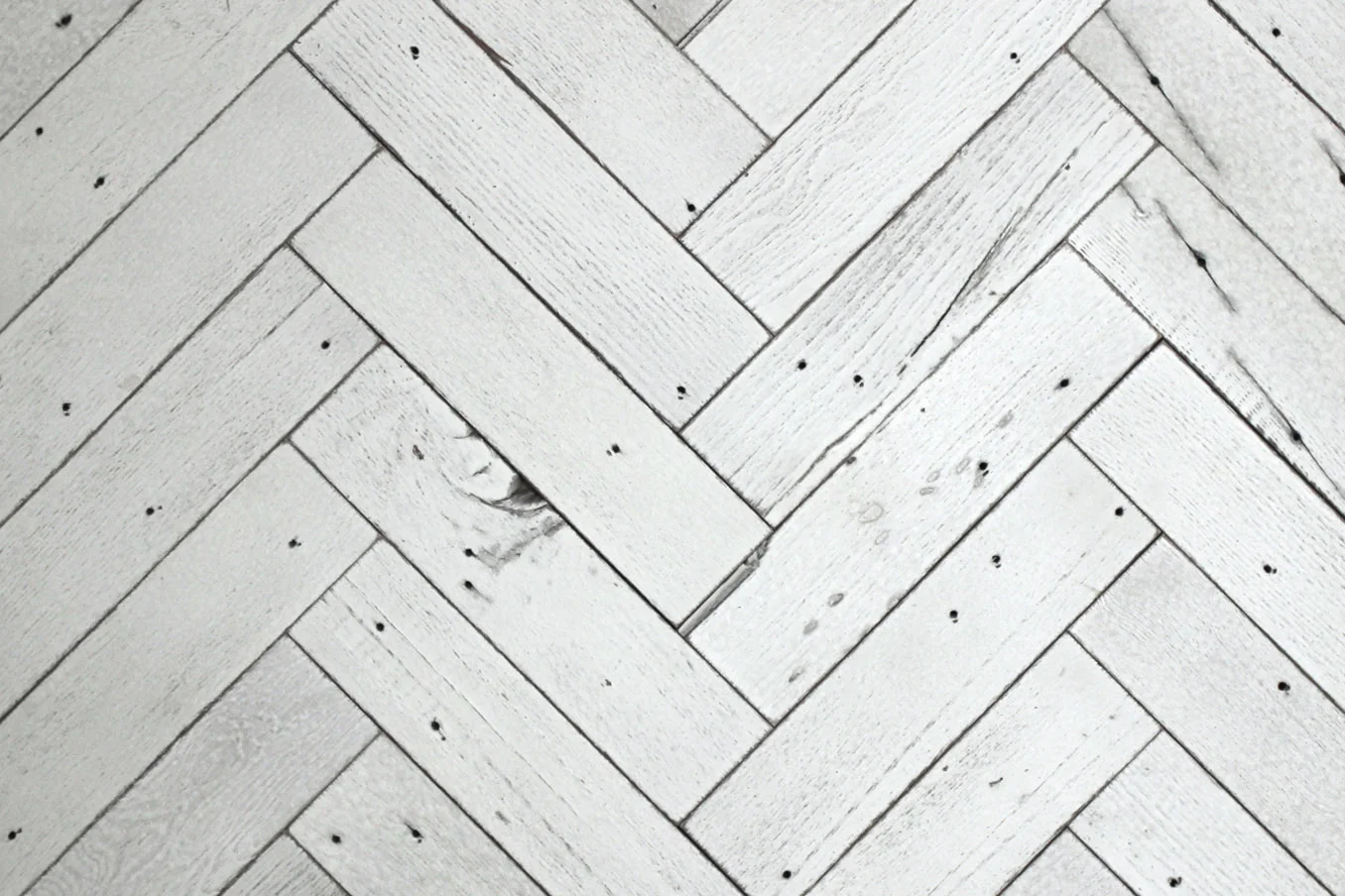 Herringbone style reclaimed wood tiles are available in any of our paneling finishes.