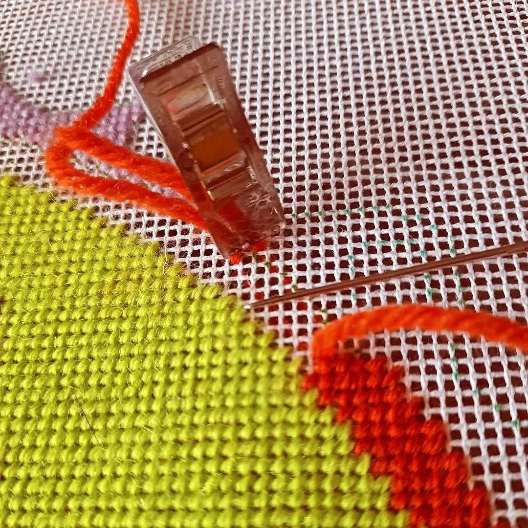 Ooo a bit of a hack here!
I'm using fabric clips to secure my threads. You can start using the waste knot method but use a clip instead of a knot. You can finish your thread in the same way. Clip the ends in the direction you're stitching and you wil