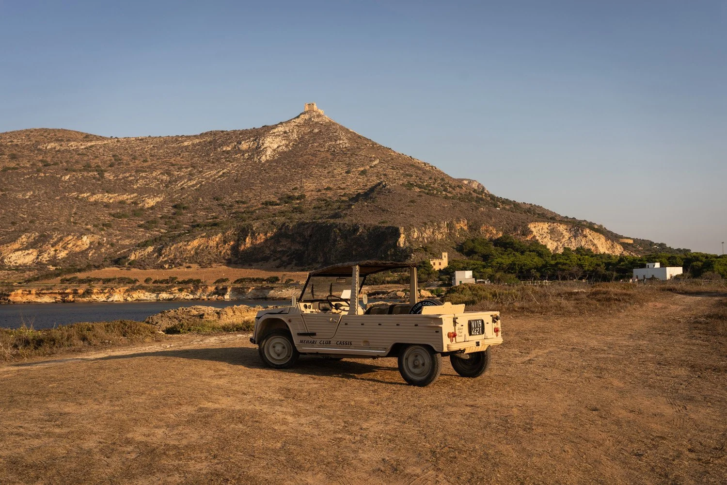 Typical mehari car in Favignana and mount Santa Caterina with the castle, view from Punta Lunga and Marasolo.