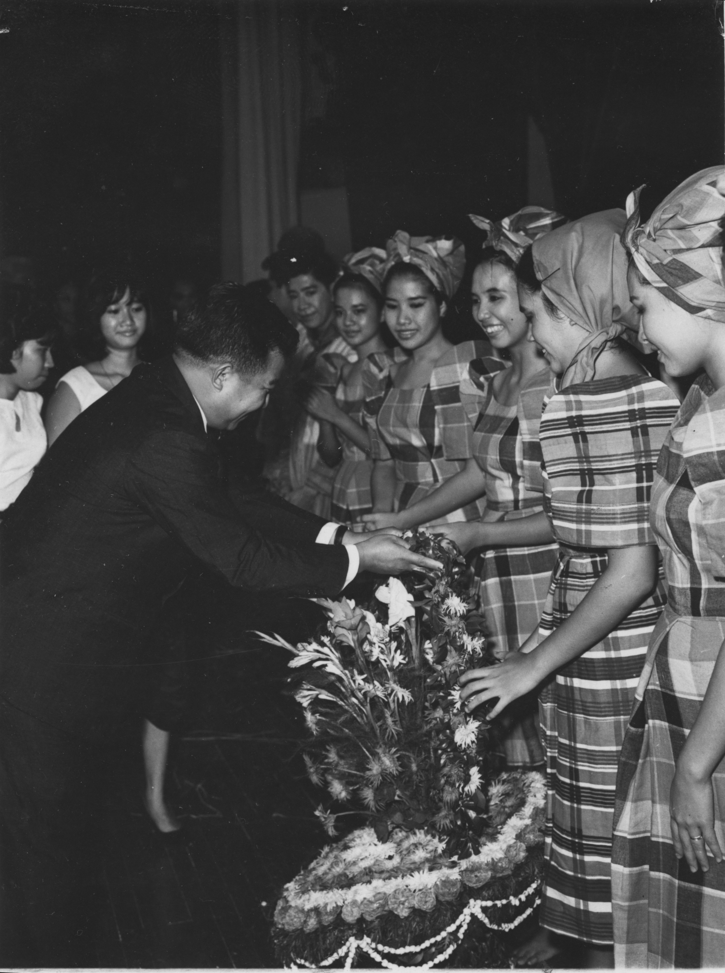 His Royal Highness Norodum Sihanouk greeting the Baranggay beauties in the presence of Princess Bophaderi.jpeg