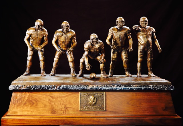 The bronze trophy for the Joe Moore Award will go to the Most Outstanding Offensive Line Unit in college football and, at more than 350 pounds, is the largest trophy in college football.