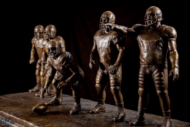 The trophy, with players that each stand more than two feet tall, will travel to each winning school’s campus and stay there until the following year’s winner is announced.