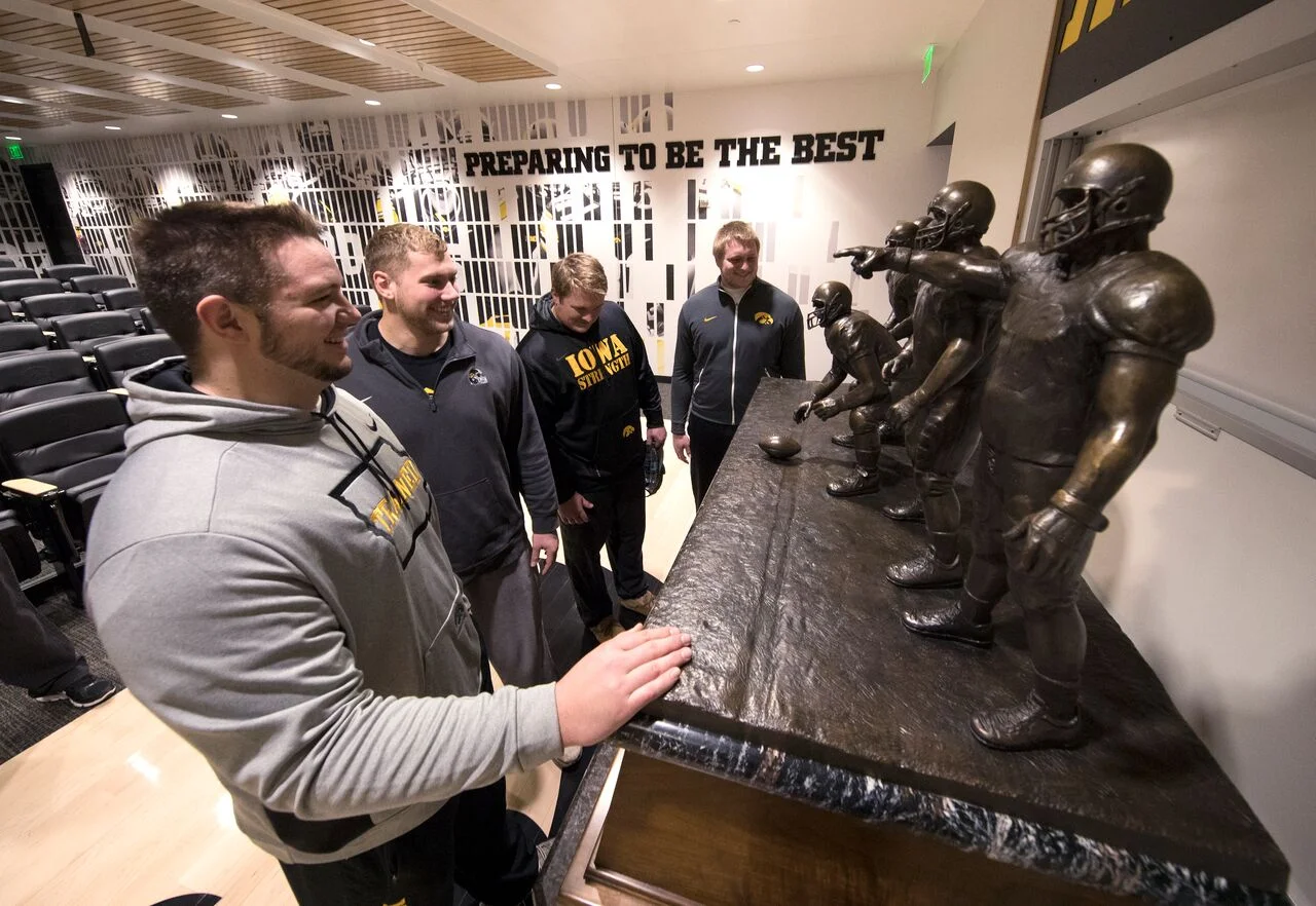 iowa team in front of award.jpeg