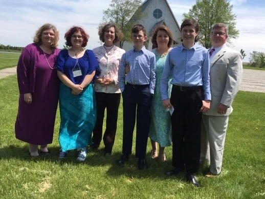 Torie Dobson with her mother Jeanine, Rev. Sara Palmer, and the Harper family: Thomas, Suzanne, Henry, and John after their Confirmation at the Procter Center in May 2019