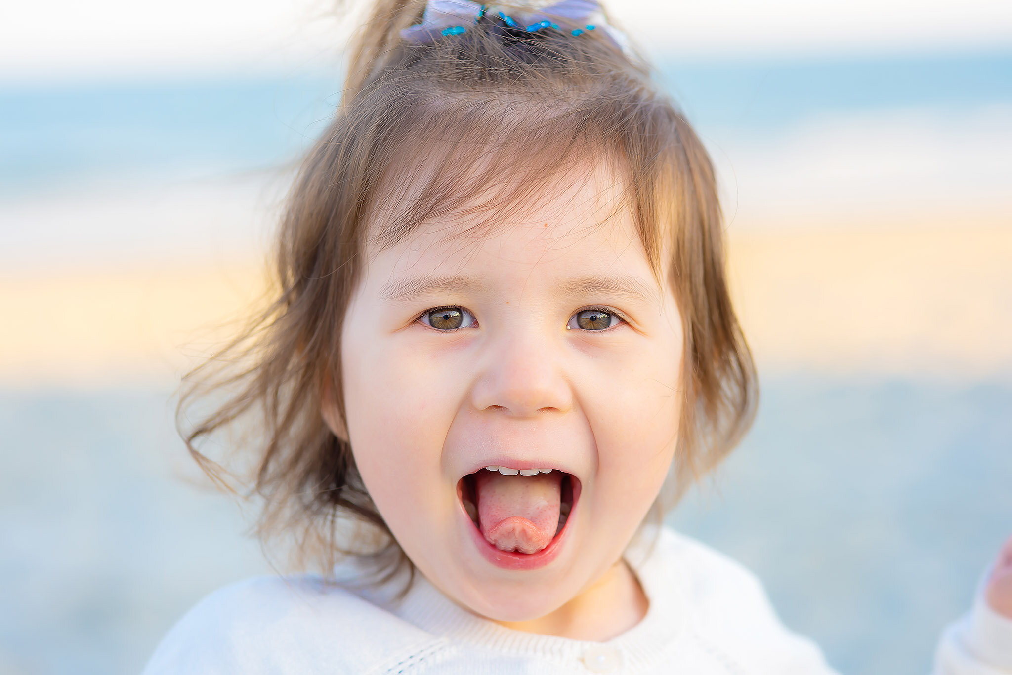 Child's portrait on the beach.