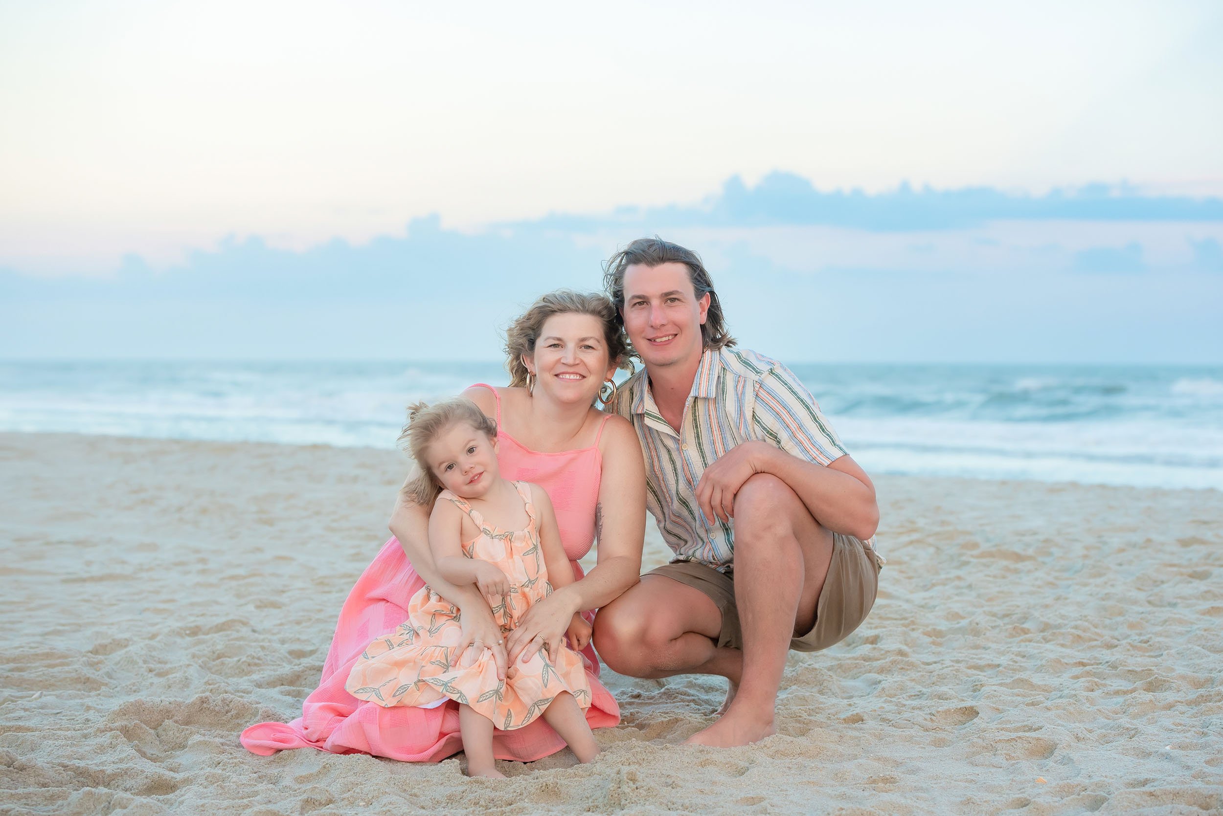 Young family of three beach photo