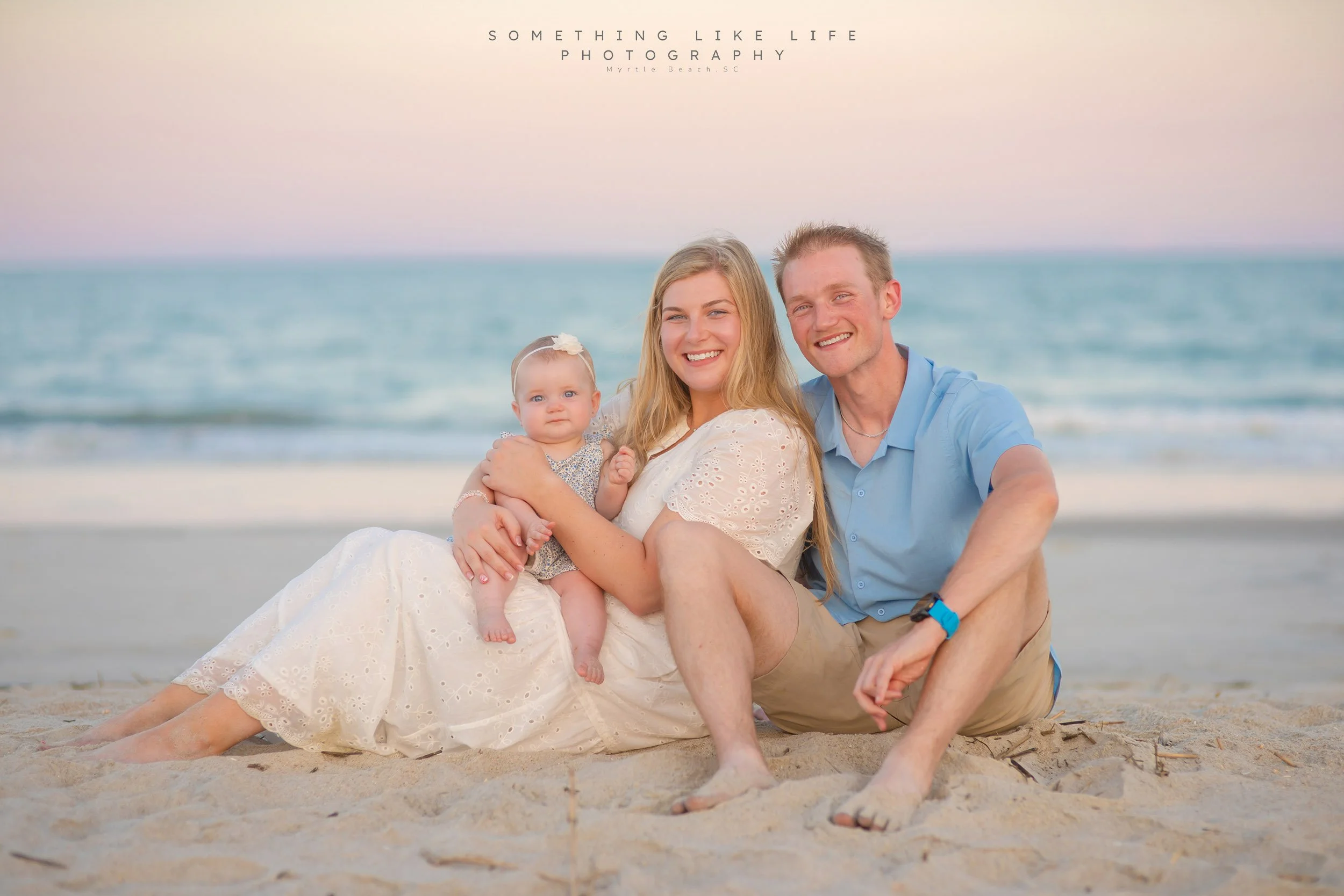  Family sitting on beach during sunset Myrtle Beach family portraits. 