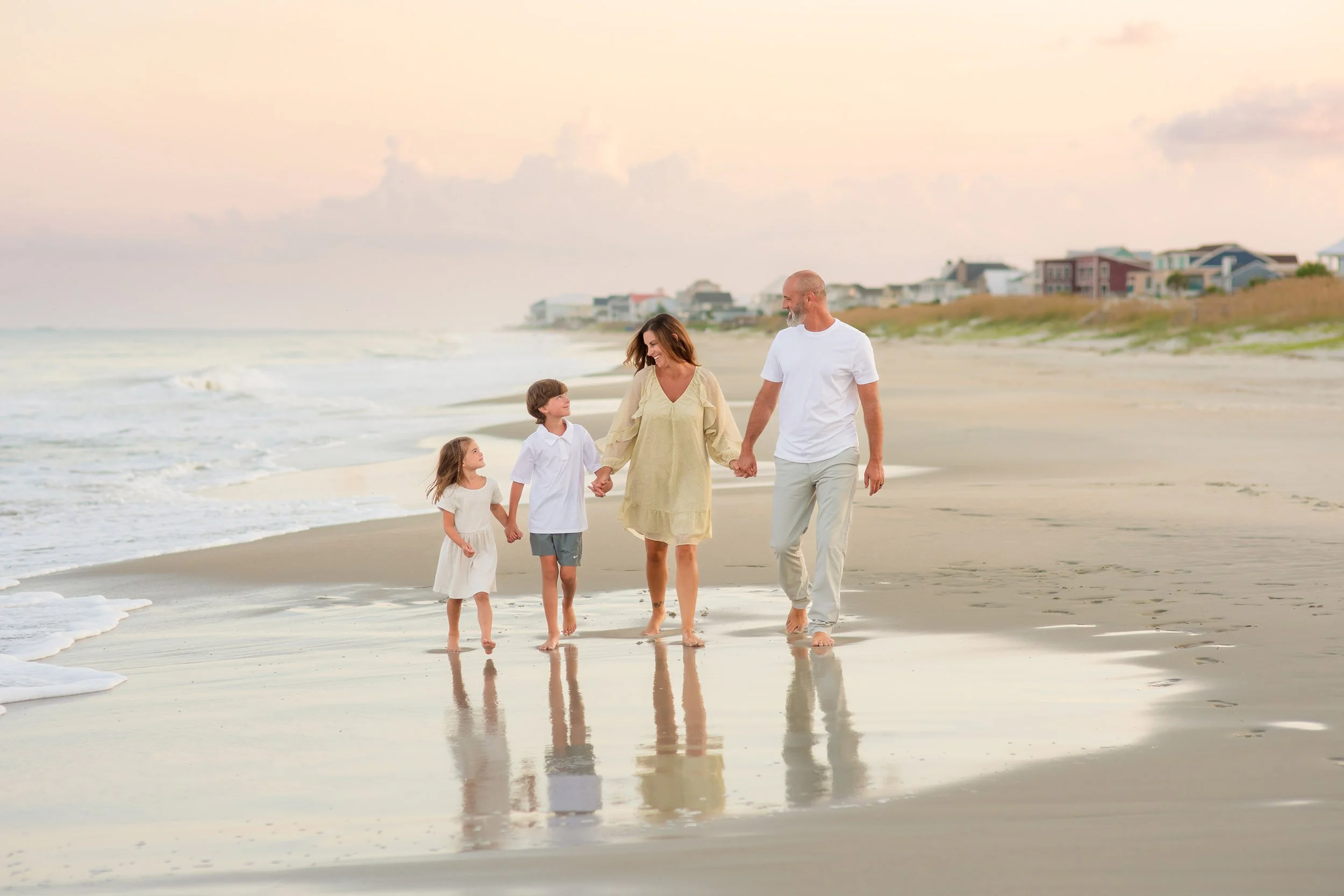 myrtle-beach-family-holding-hands-photographer-sunset-session.jpg