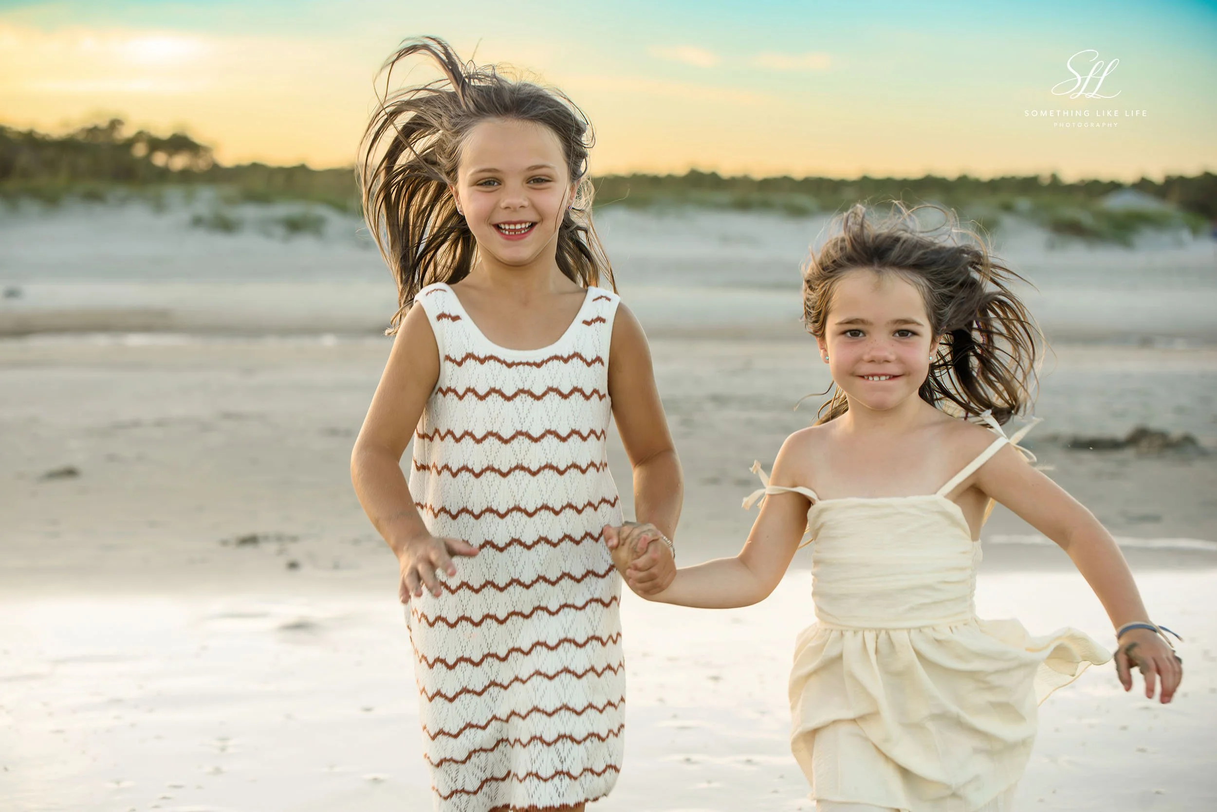 Sisters Running on the Beach | Huntington Beach State Park Family Photographer