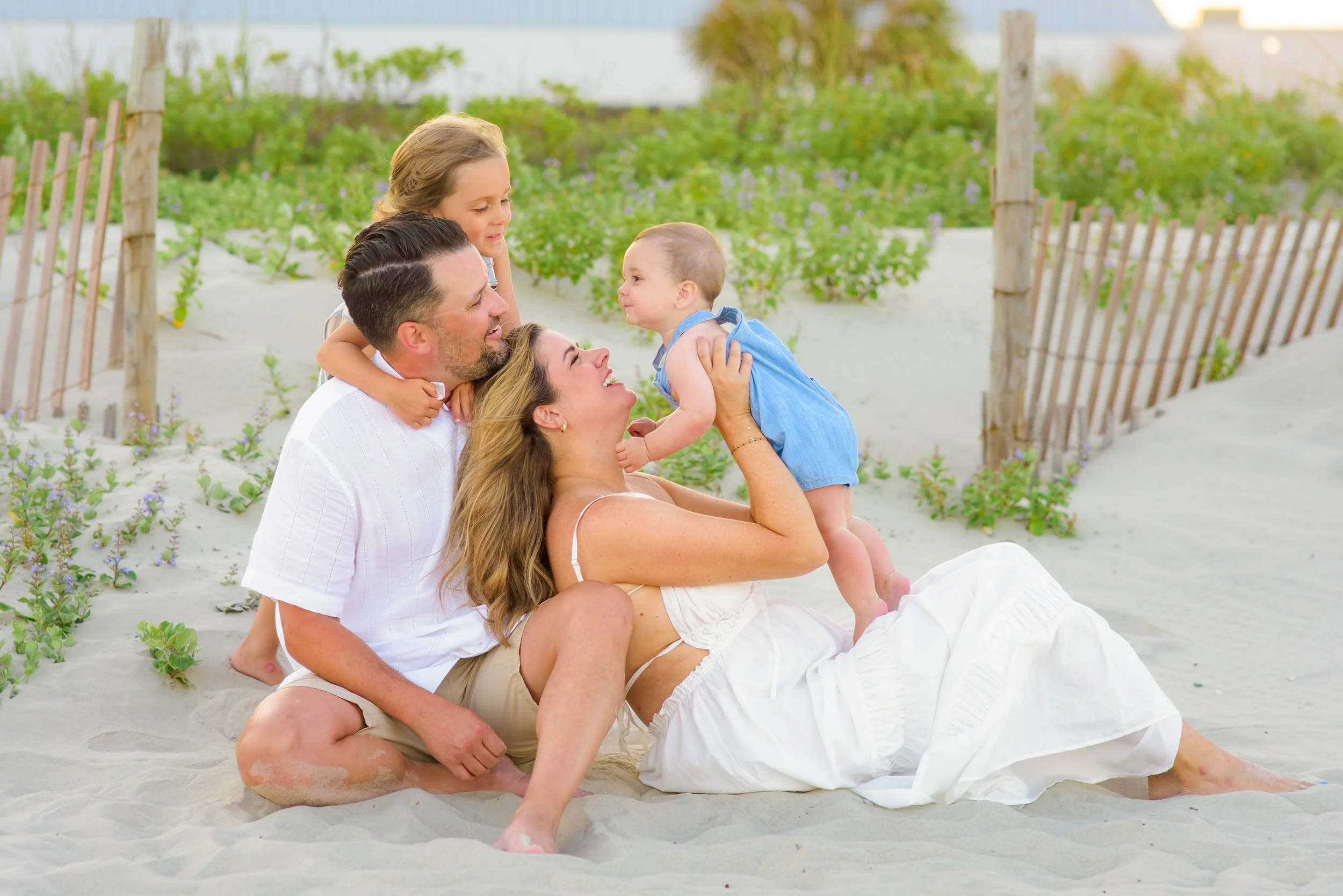 A family spending time together on the beach at sunset