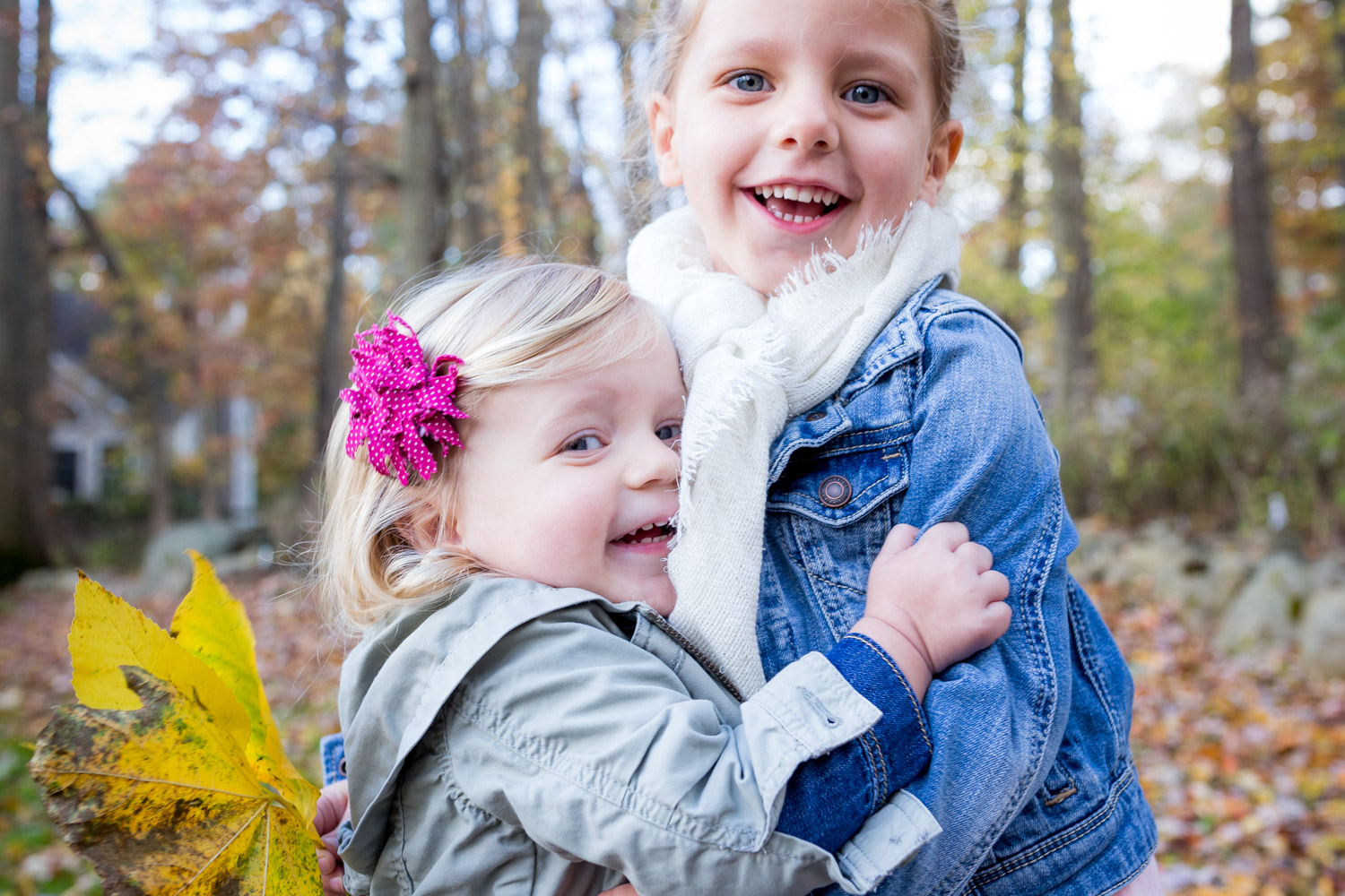 sisters hugging outside