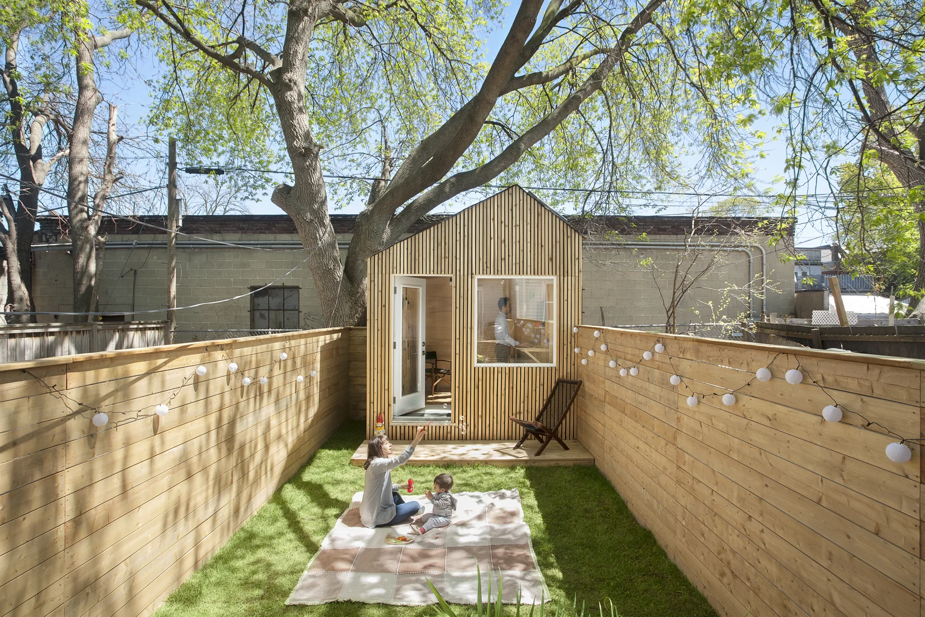 The studio being visually and physically connected to the yard and house allows the clients to connect together as a family more easily