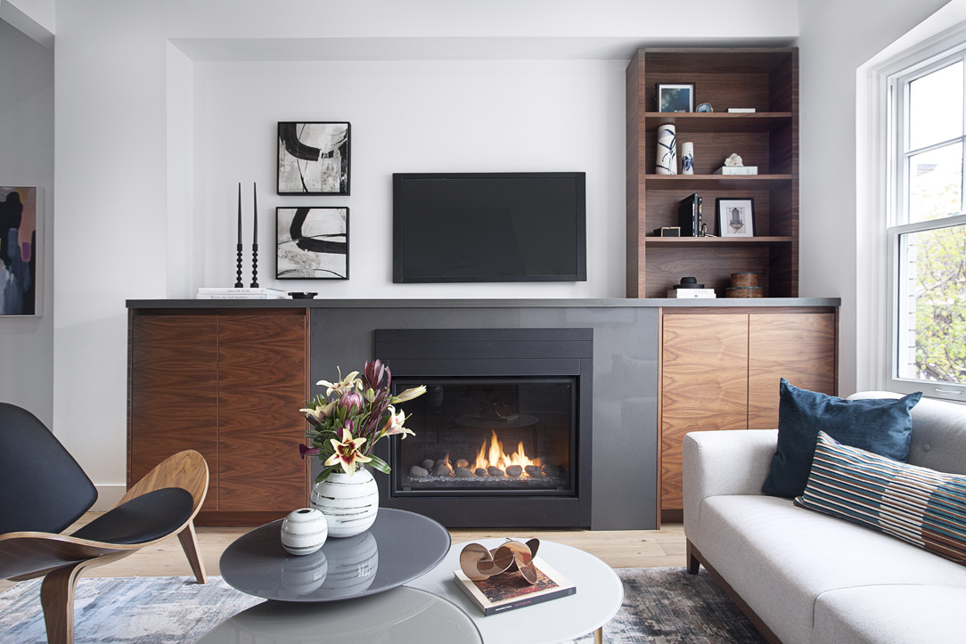 This project is an exercise in opening up a divided ground floor to create an integrated living/dining/kitchen space with a family room. Custom millwork pieces allow for a design that maximizes the width of the house while providing as much storage as possible. The materials (Navy, Gold, Marble and Walnut) are coordinated throughout the floor to create a cohesive space that seamlessly blends in from one vignette to another.