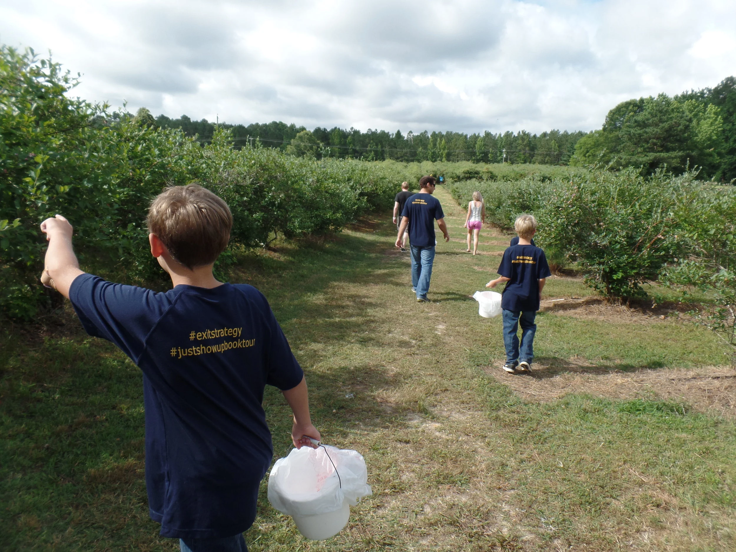 There were so many blueberries. We grabbed the buckets and hiked through the field.