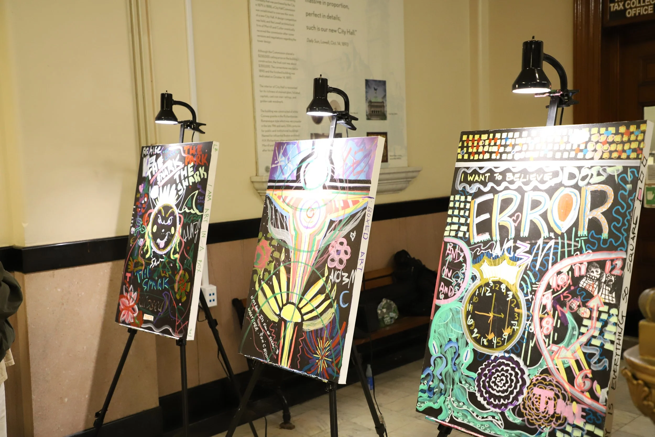 Skribble Studio & Refuge Lowell - February 2024 - Exhibited three Skribble Project Community Canvas works in addition to the following works by Refuge Lowell artists: “Snailed It” by Eclipse Hin, “The Lovers” by Zachary MacIsaac, and “Pour Me Some Co