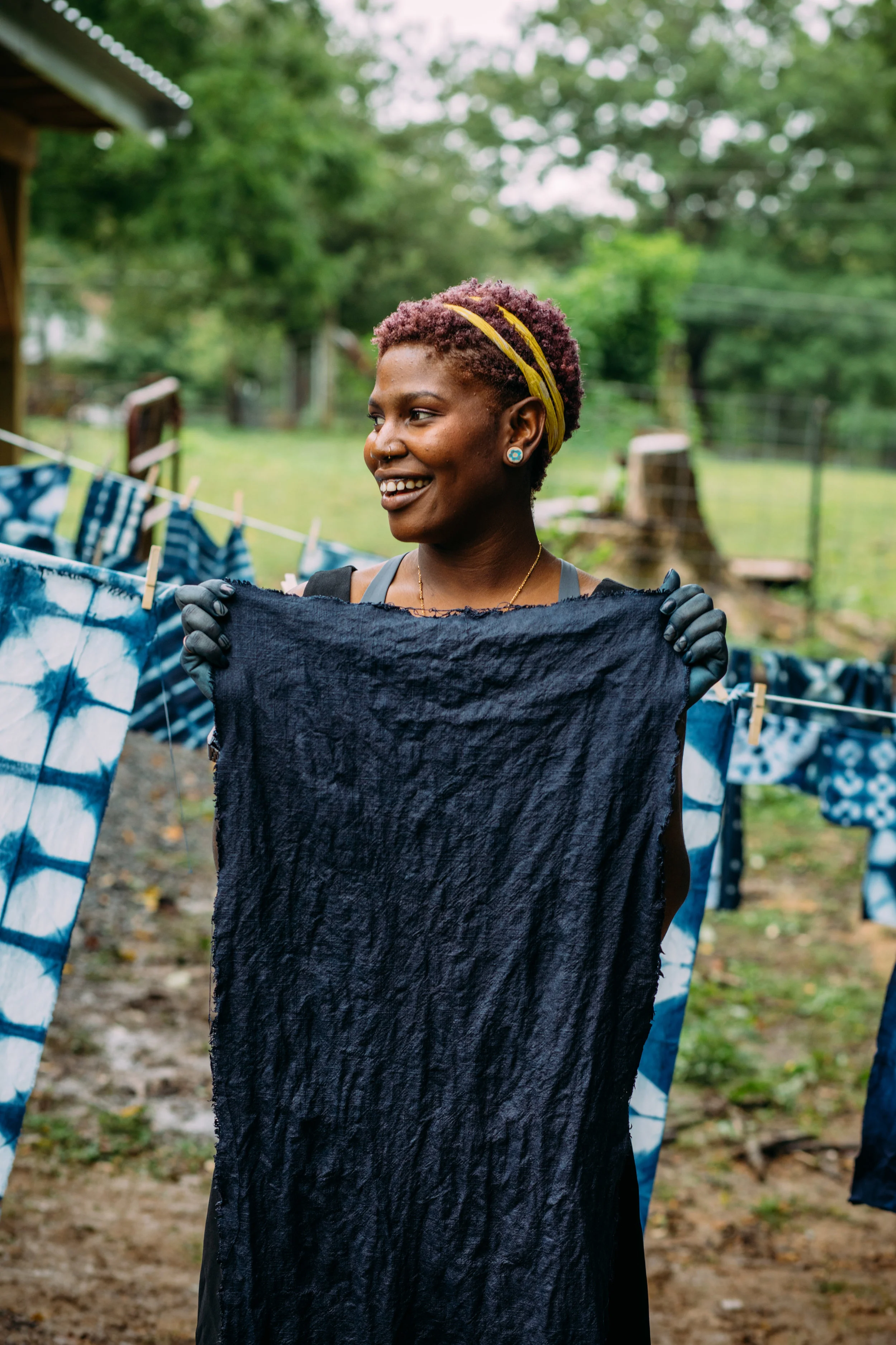 Felistas with her beautifully rich indigo-dyed linen. Photo by Grace Boto