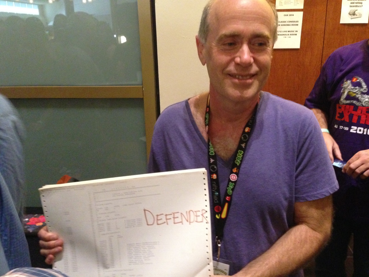 Sam Dicker with a printout of the Defender source code from CAX 2014
