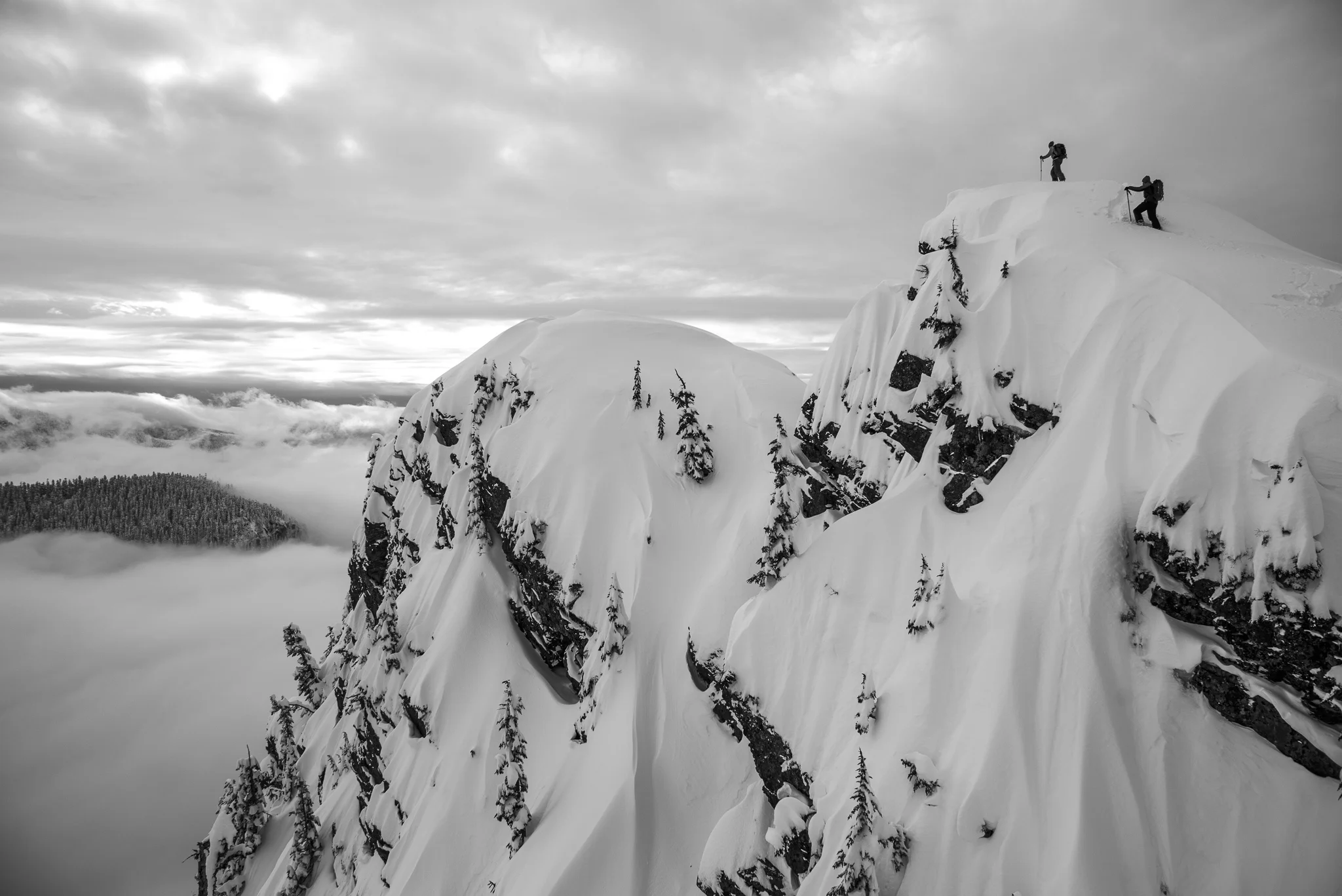 Kameron Harris and Drew Tabke reach the summit of Guye Peak.
