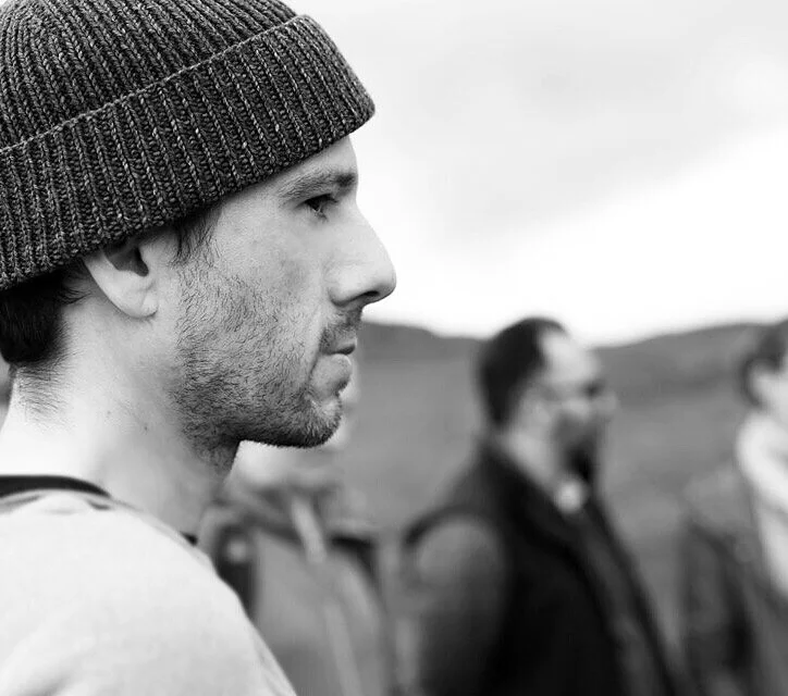 Zac contemplating how he can consume more coffee.