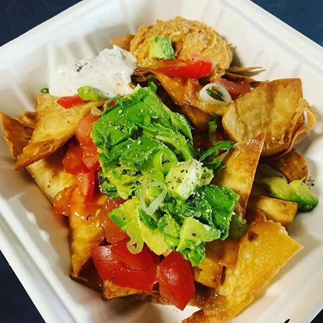 Ma*Rock Nachos BETA ! House tortilla chips, harissa hummus, garlic-rosemary sour cream, tomatoes, scallions, and avo 🔥 not your everyday nachos 🙌 working on what else to load them up with... melty cheese shreds.. jalapeño slices.. can’t wait