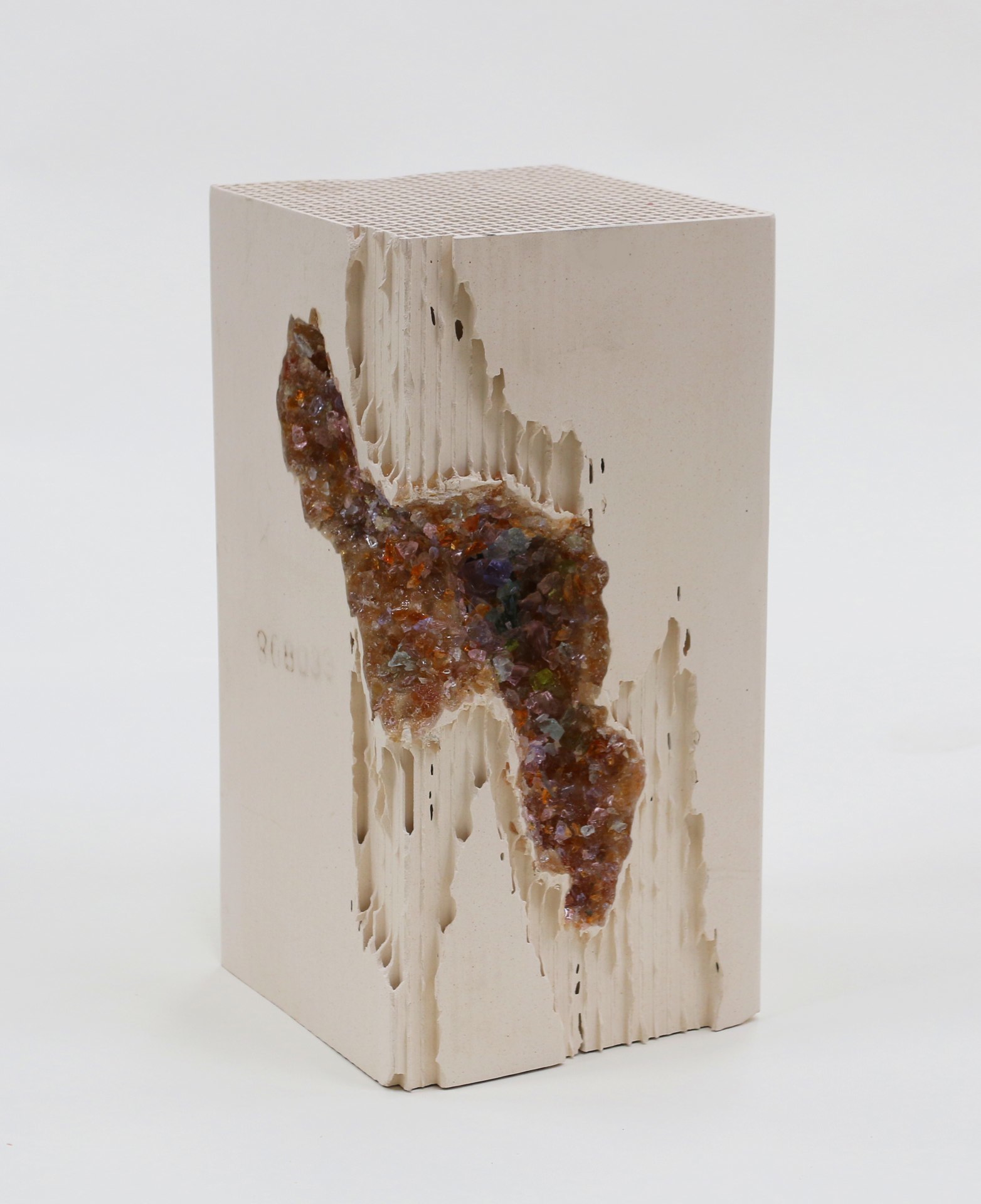 Red Vug, 2014, lead crystal embedded in engineered ceramic block, 12 x 6 x 6 inches