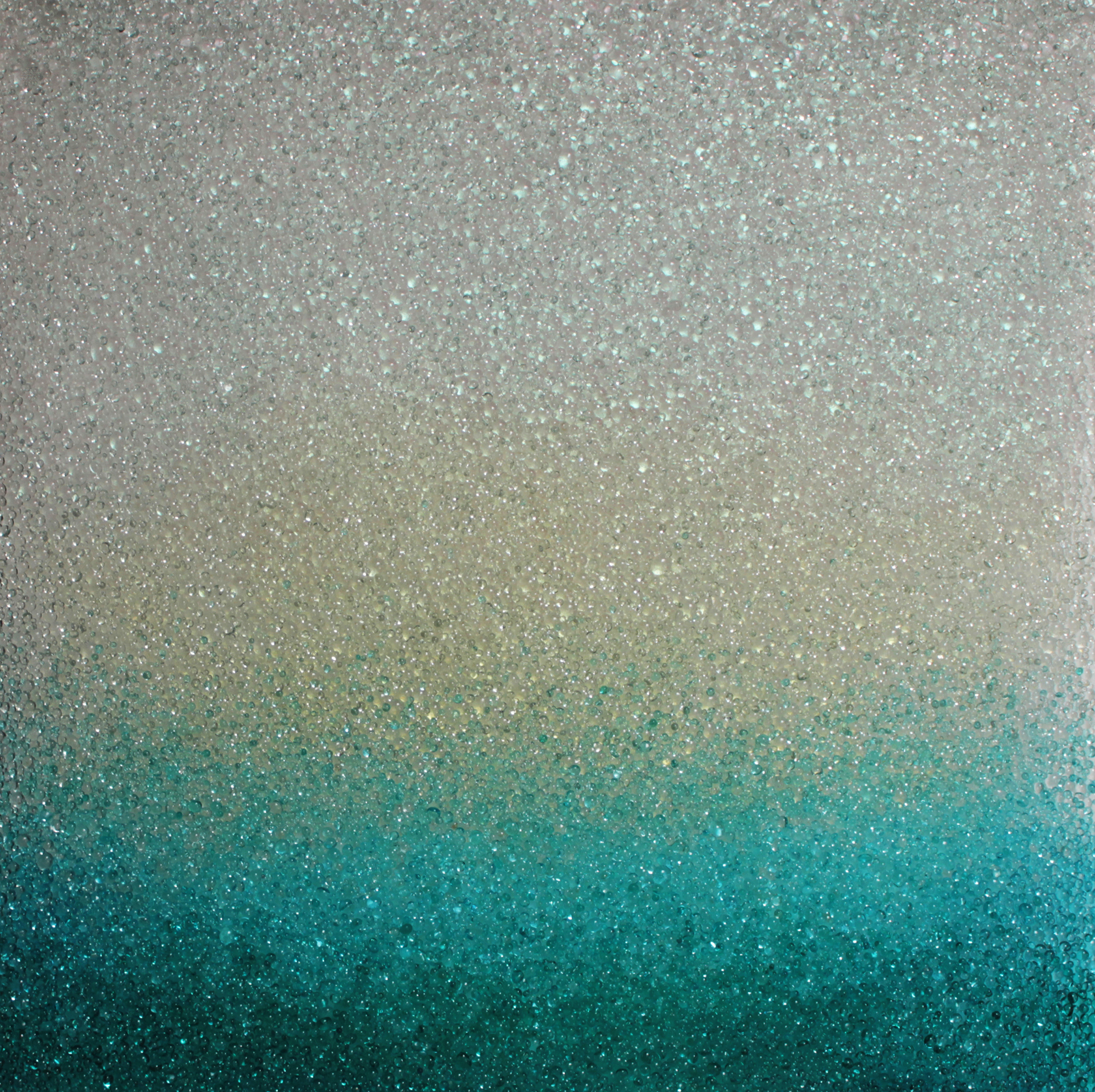 "Turquoise Glimmer," 2018, kiln formed glass, iridescent pigment, 22 x 22 inches