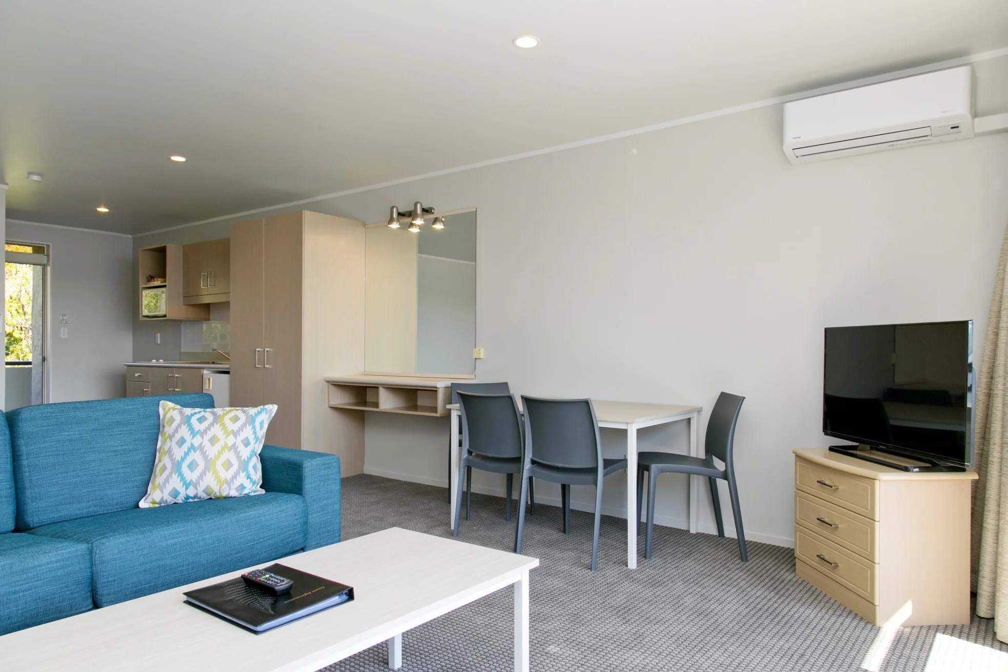 spa studio with lake view living area and kitchenette 1.jpg