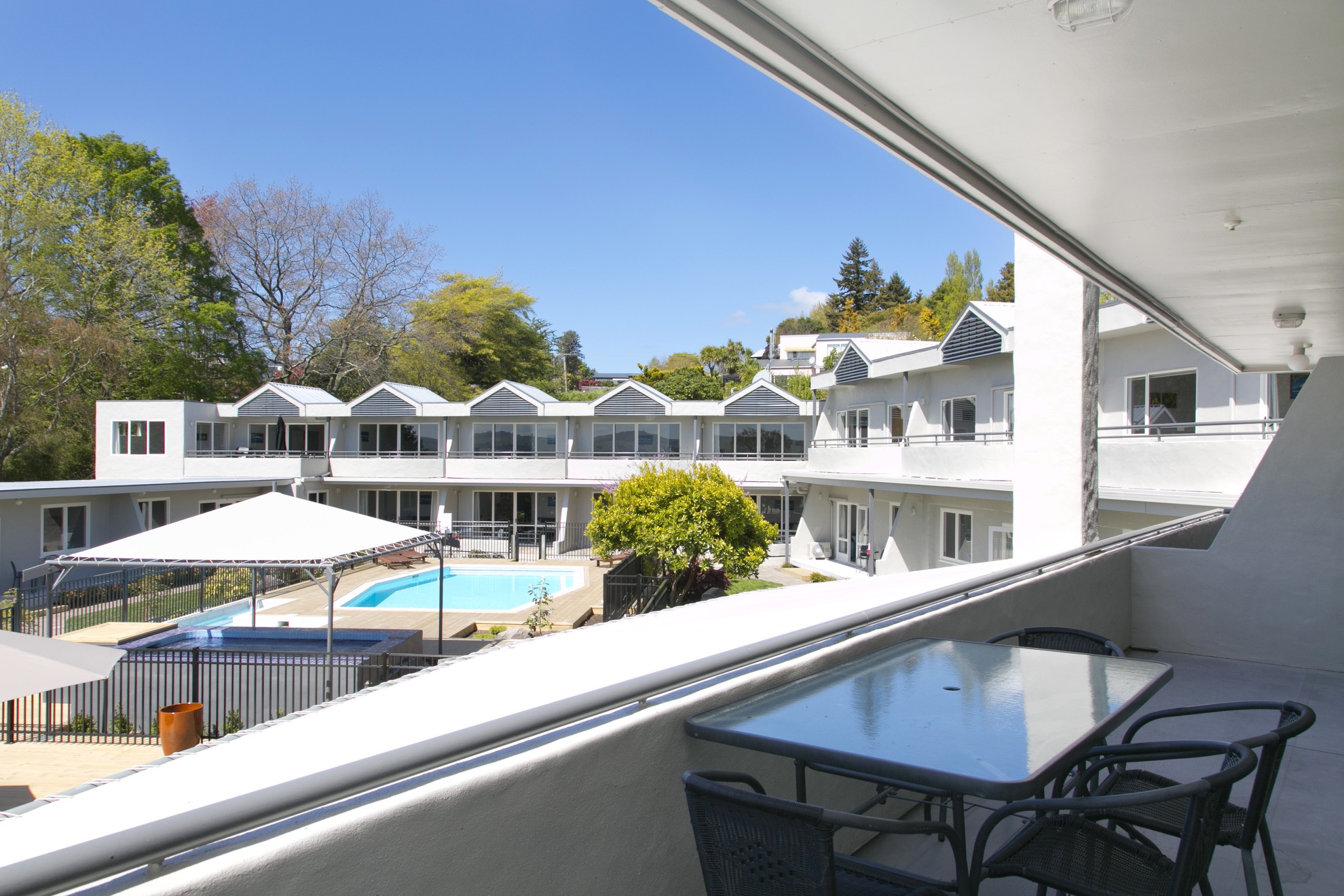 deluxe one bedroom balcony overlooking pool 1.jpg