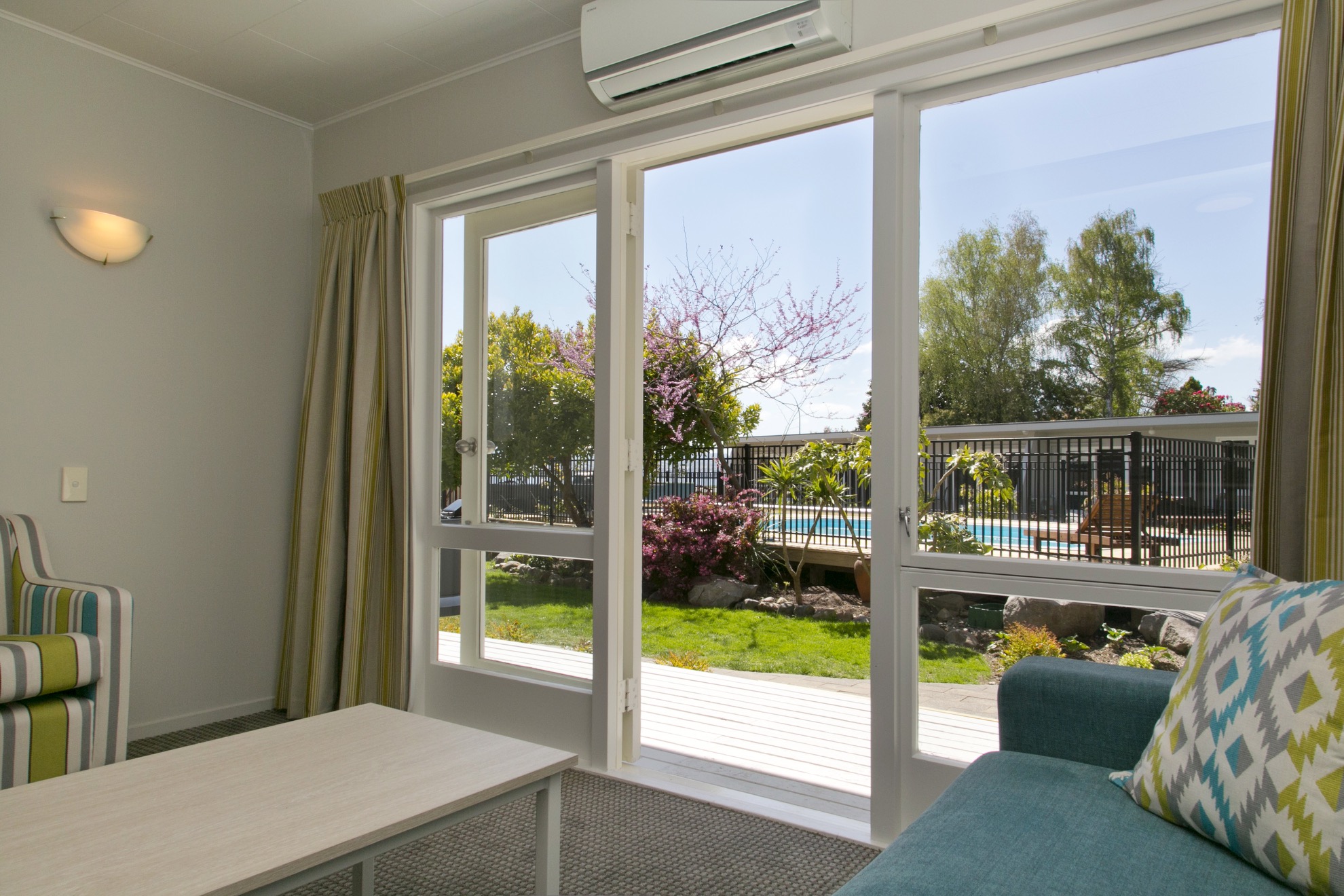 two bedroom poolside view from living area 1.jpg