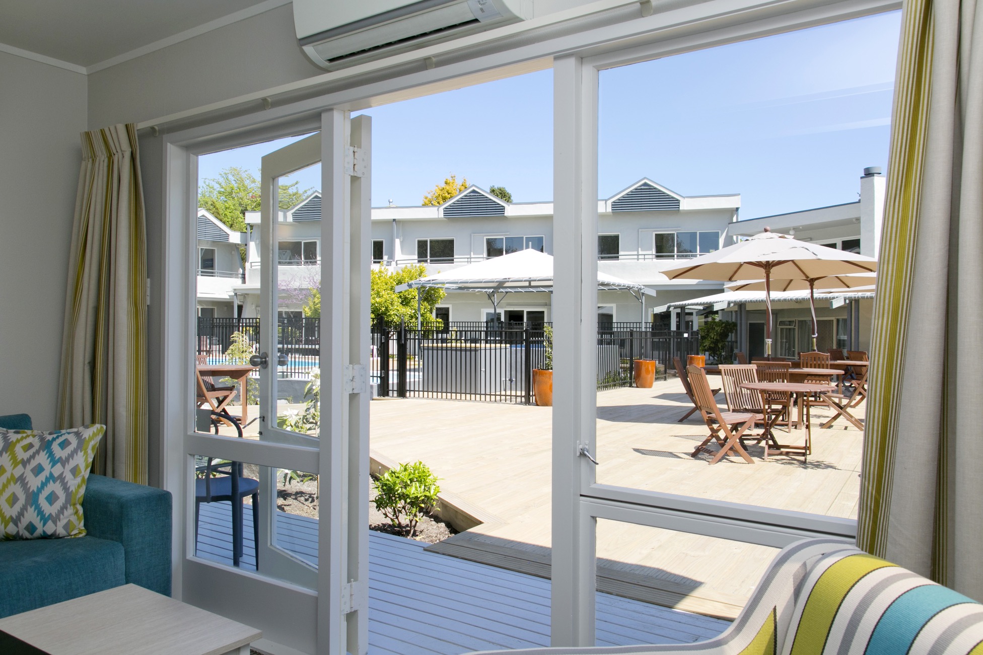 two bedroom poolside with lake view looking onto pool area 3.jpg