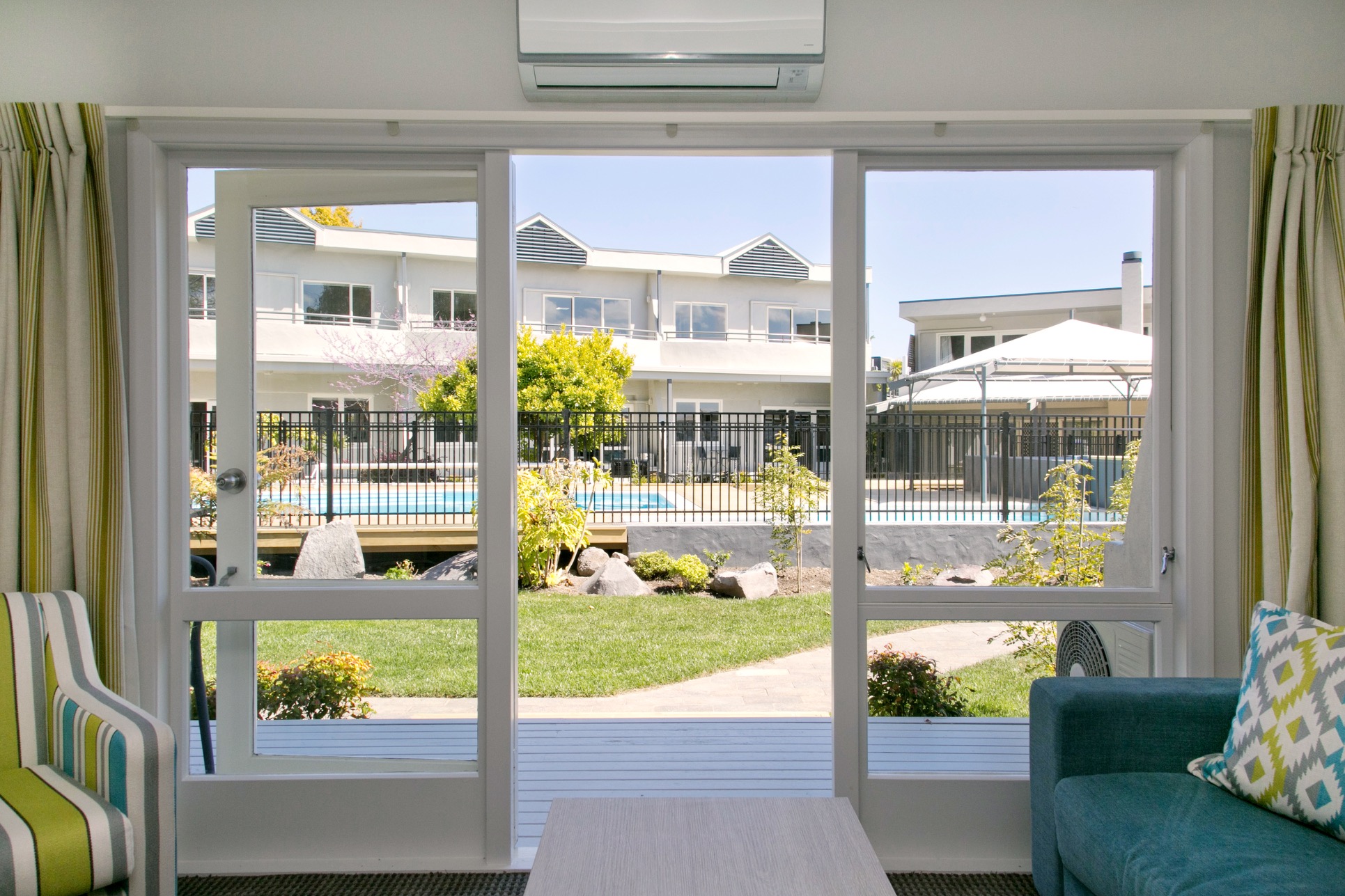 two bedroom poolside with lake view looking onto pool area.jpg