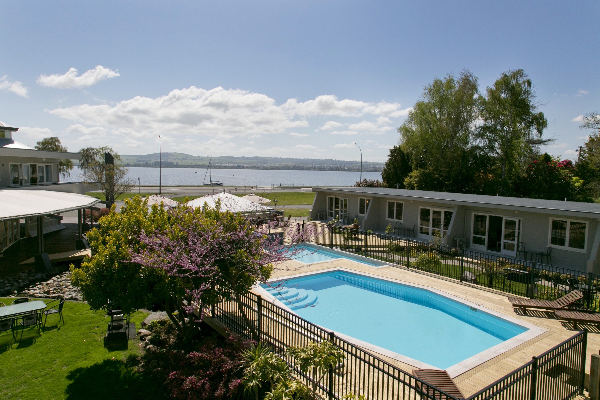 two bedroom lake view view form balcony over pool area.jpg