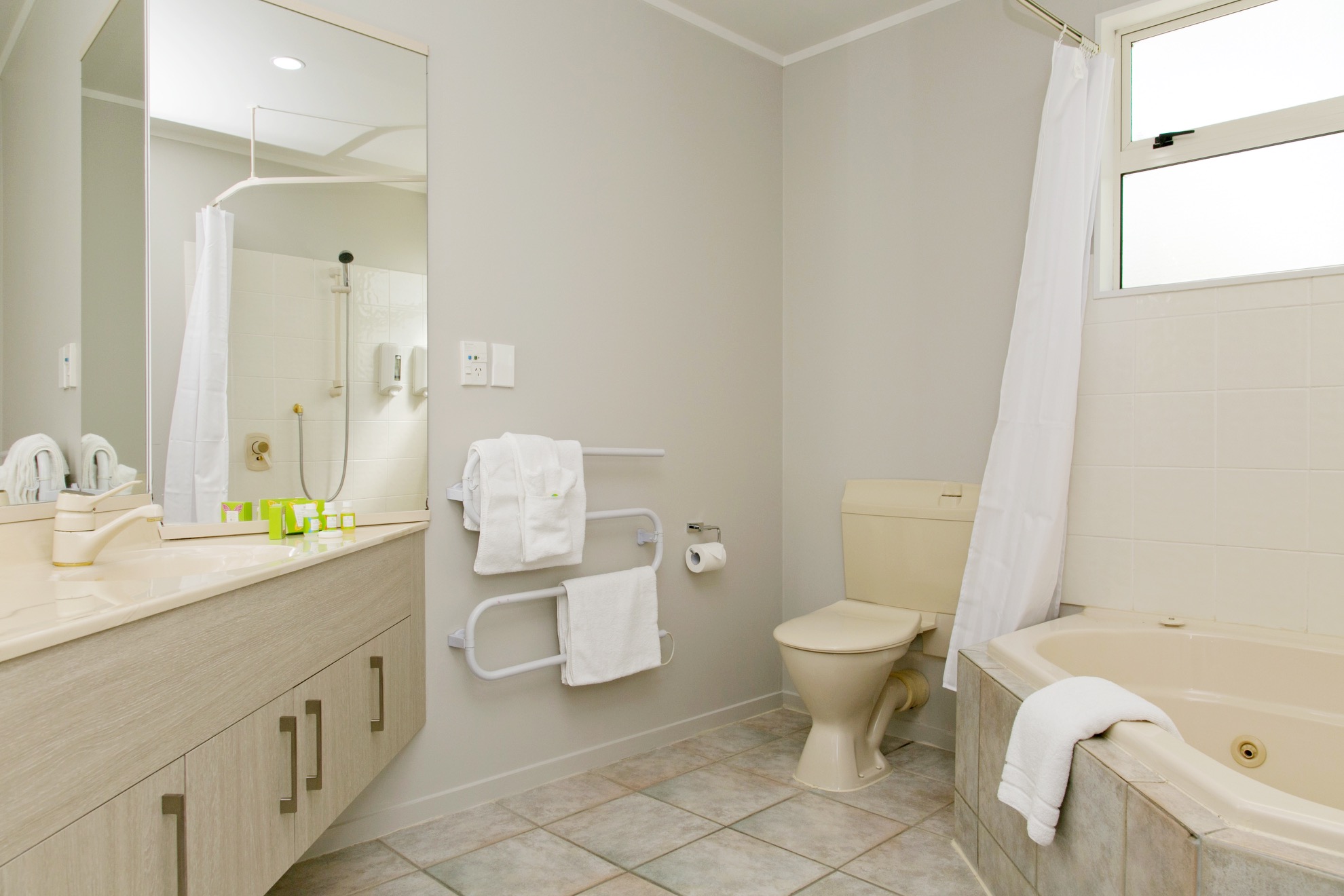 three bedroom bathroom with spa bath.jpg