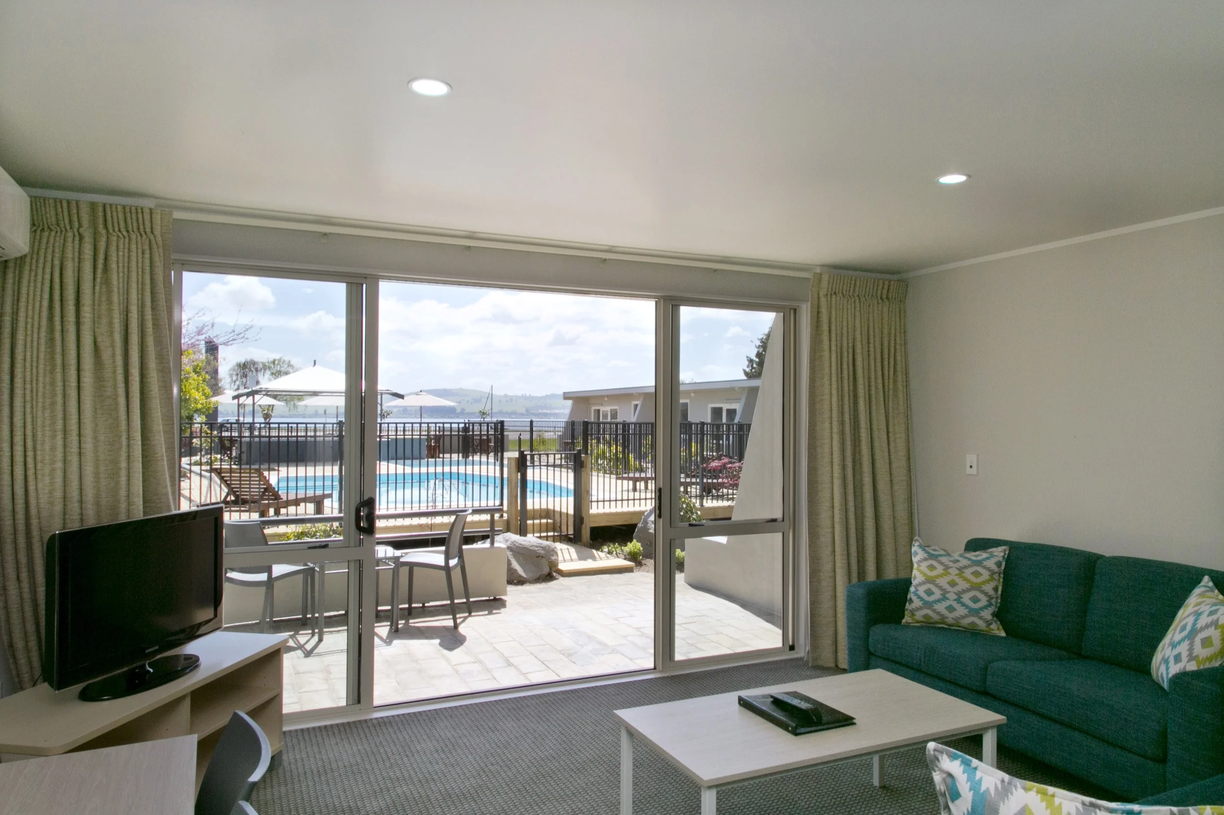 One bedroom poolside living area and view 1-min.jpg