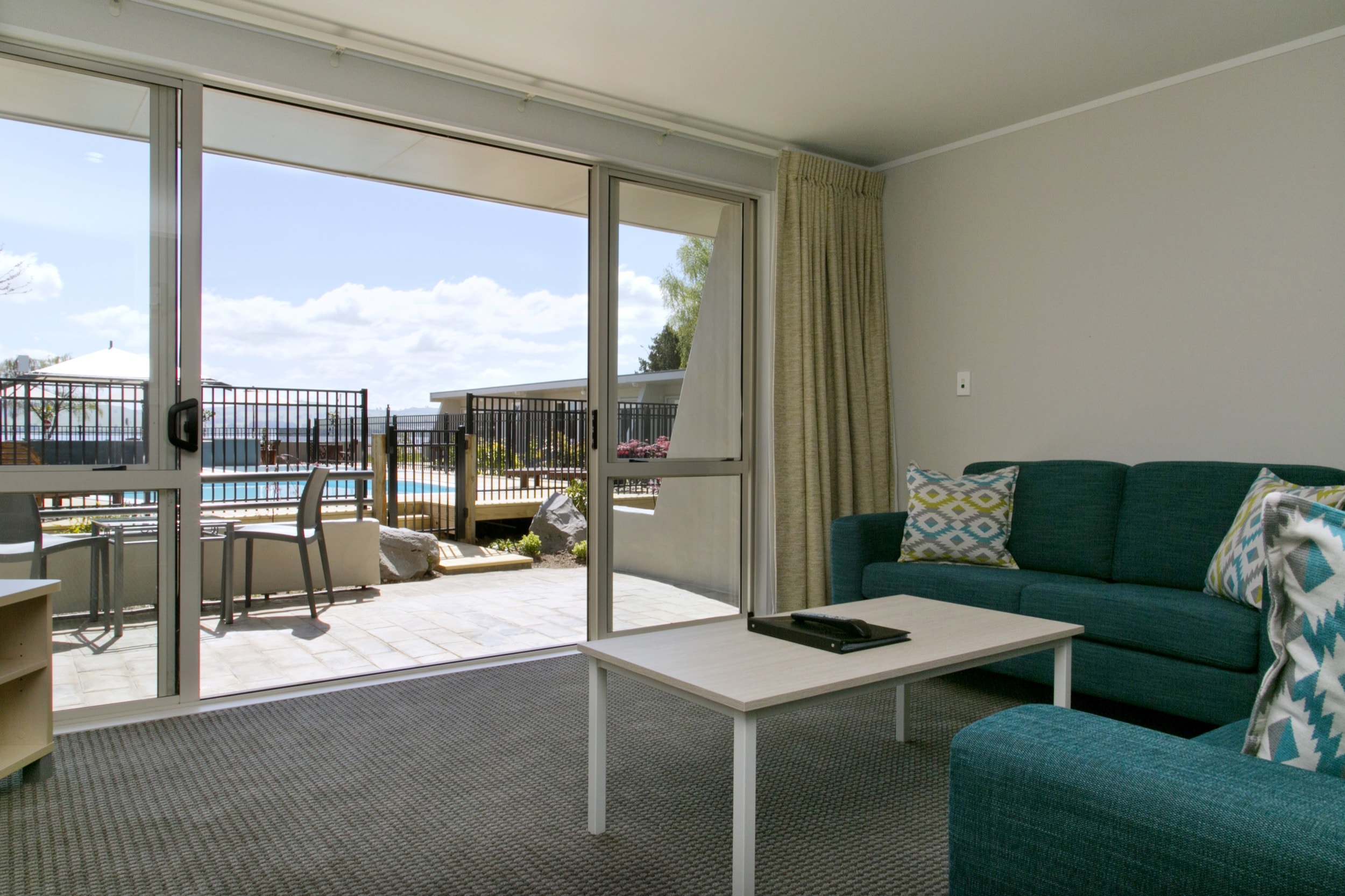 One bedroom poolside living area and view 2-min.jpg