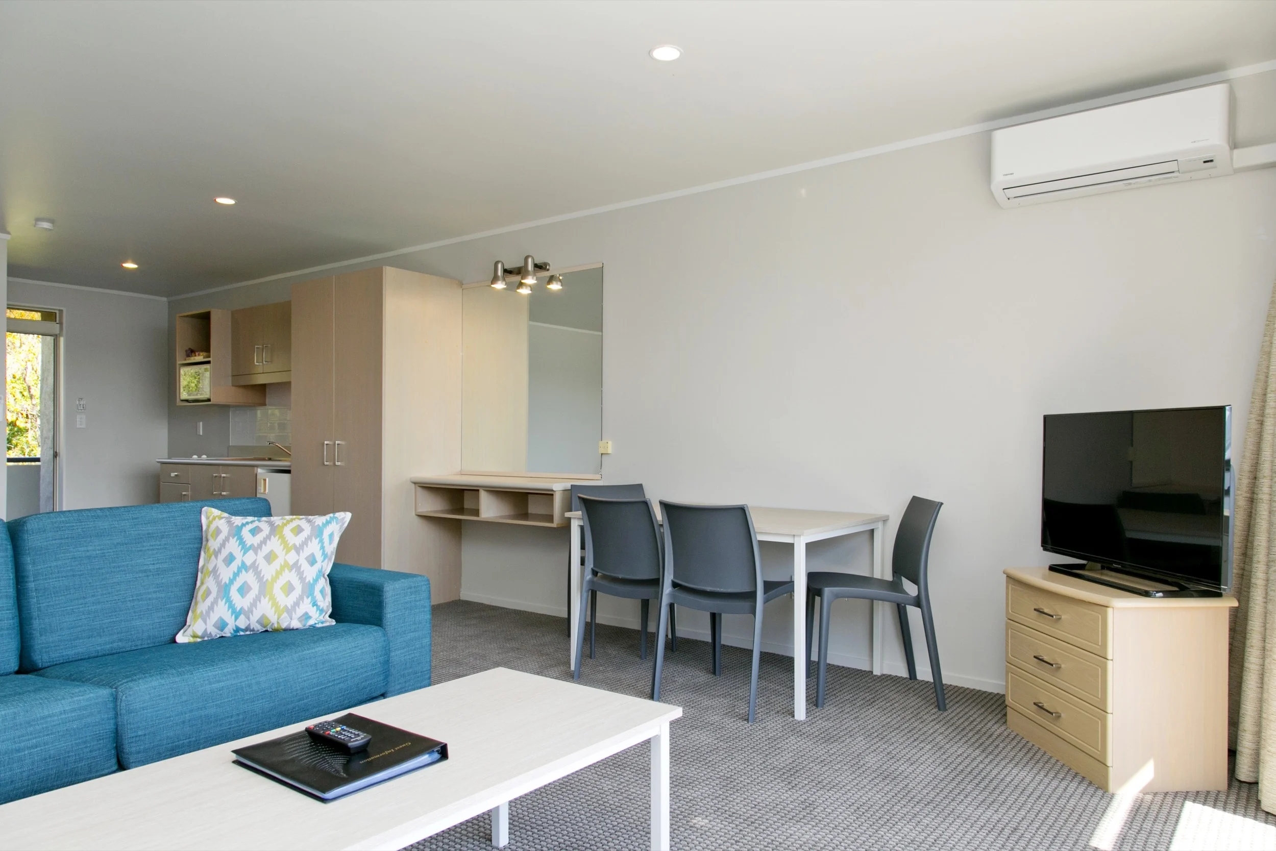 spa studio with lake view living area and kitchenette 1-min.jpg