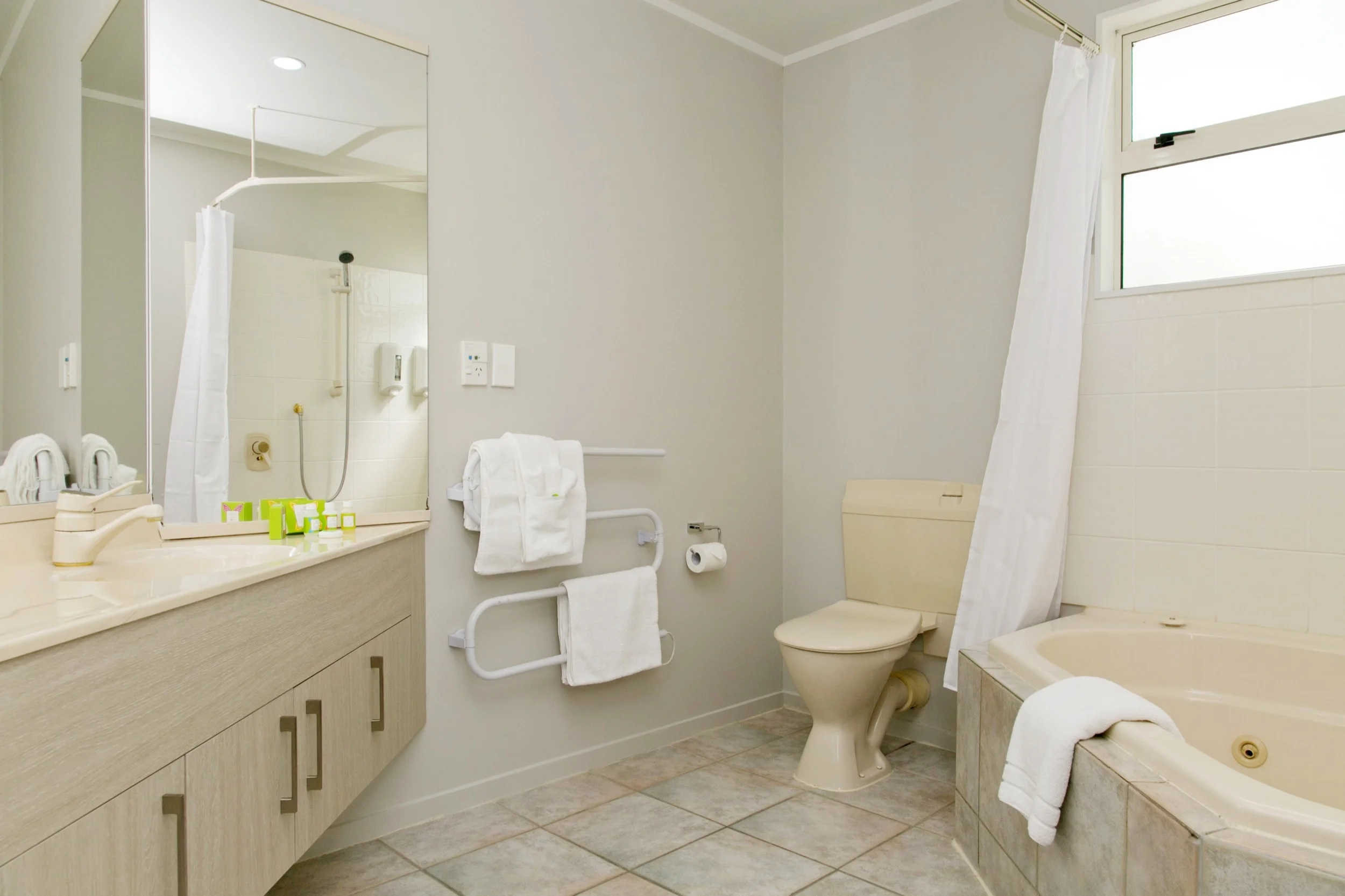 three bedroom bathroom with spa bath-min.jpg