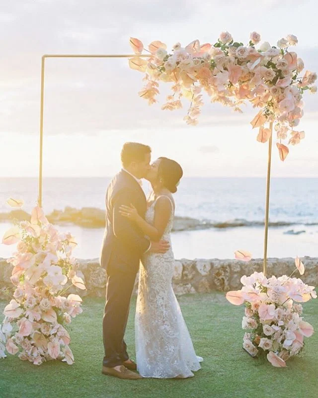 Magic Hour | The guests flew in from as far as London, New Zealand and Japan to see these two love birds get hitched in Hawaii and we are pretty sure none of them will ever forget this perfect day! We designed the ceremony arch of our dreams and @mandygracedesigns brought it to life even more beautifully than we imagined with help from a custom built gold arch by @alohaartisans. As featured in @martha_weddings with perfect captures by the talented @omalleyphotographers