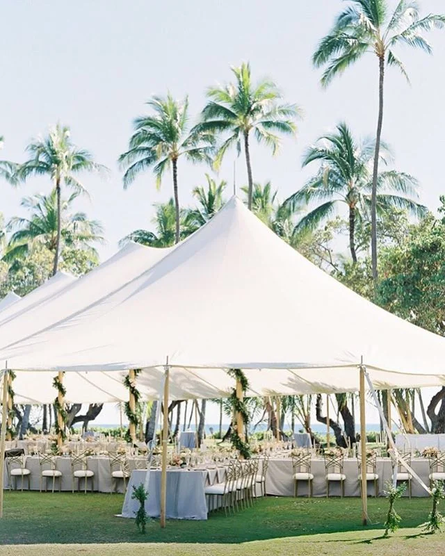 Wedding Day | Palm trees and ocean views are the perfect compliment to an airy white sailcloth tent. While tents are not alway necessary in Hawaii, they are a wonderful way to not have to worry about the weather outdoors on your big day.  And not only do they provide shade and shelter, but they are an ideal way to define a space. As featured in @martha_weddings | Tent + Rentals @accelrentals | Flowers @mandygracedesigns | Linens @theweddinglinenco | Lighting @blazeentertainment | Photo @omalleyphotographers |