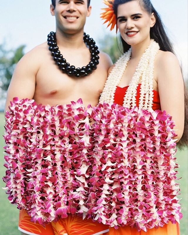 Destination Wedding | It is always a great idea to have a welcome event for your guests when they are traveling to your destination wedding. We love to have fun with our welcome events and in Hawaii that often means welcoming our guests with a traditional lei greeting with local lei greeters, like we did at this wedding weekend earlier this year.  It is also a great time to highlight destination specific customs, foods or flowers into your design, so your guests can experience more of the destination. | Lei Greeters @ringoffirehawaii | Photo @omalleyphotographers |