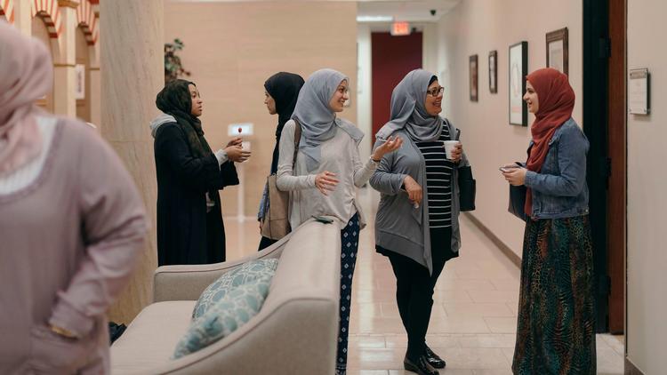 Members converse after prayer at Centro Islámico mosque in Houston. (Todd Spoth / For The Times)