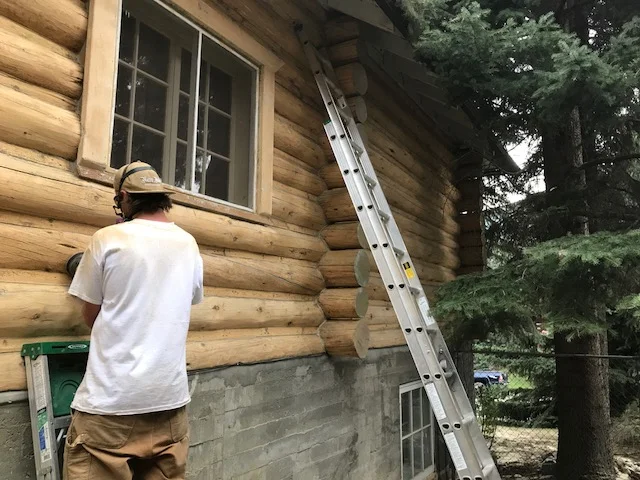 Banff logs blasted and being sanded.JPG